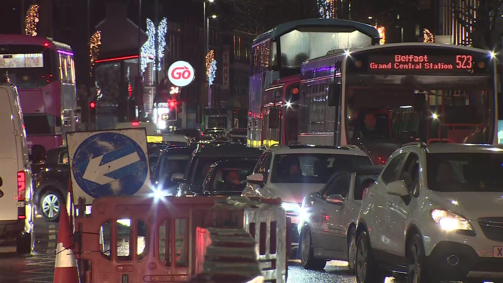 Traffic congestion in Belfast city centre in December last year. A number of cars with their lights on are bumper to bumper during evening traffic with a number of buses also queued in the congestion