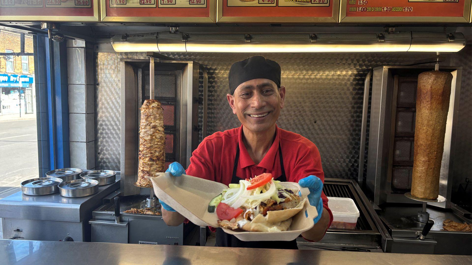 man serving a kebab