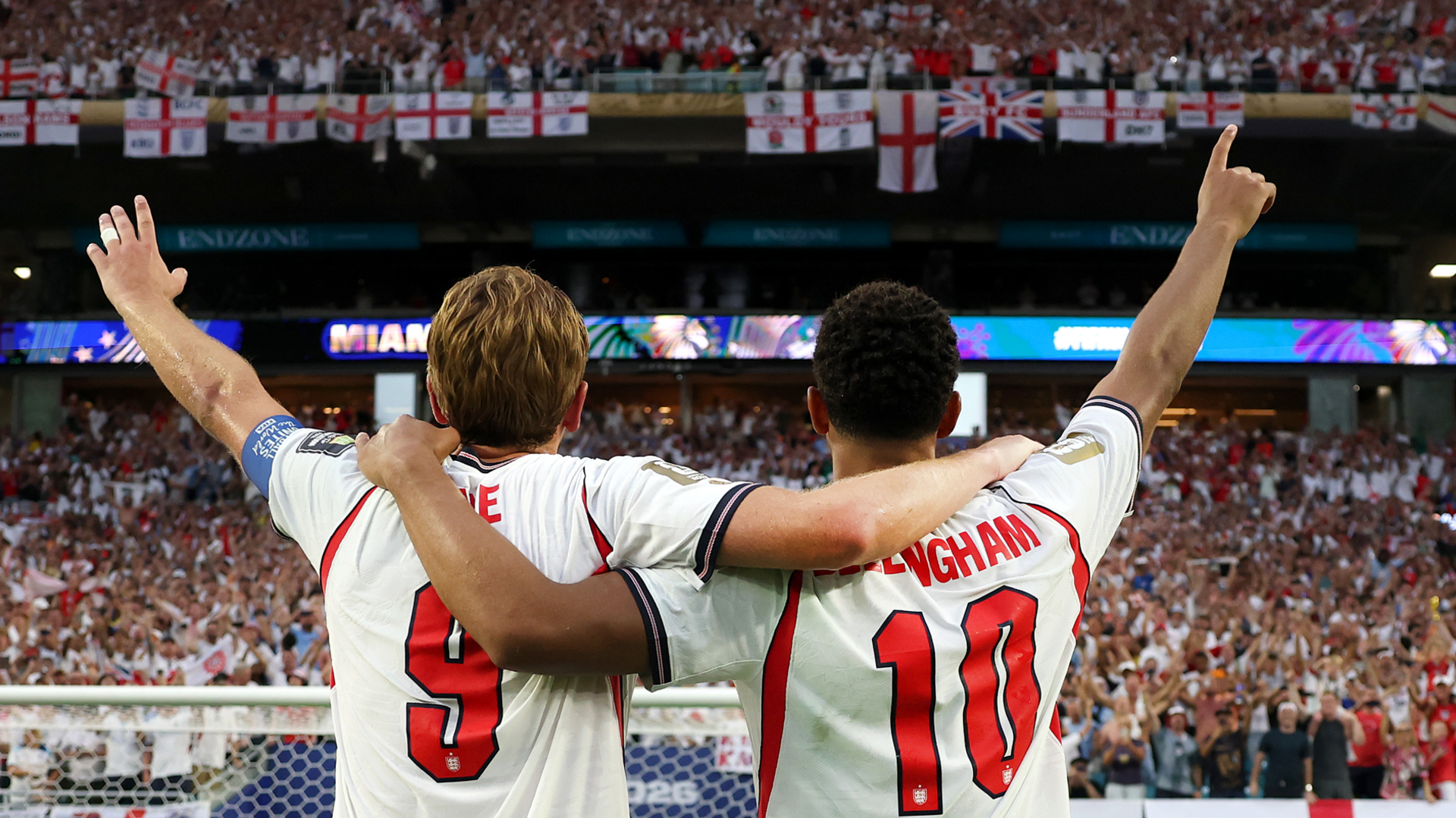 Harry Kane and Jude Bellingham raise their hands to England fans