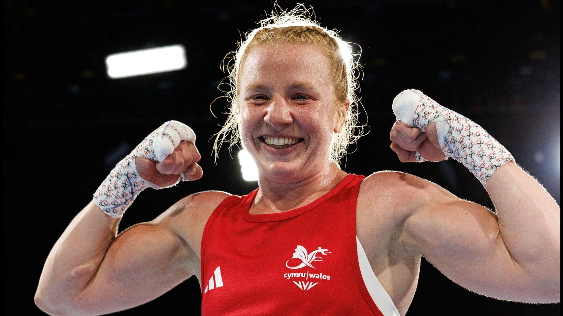 Rosie Eccles poses after winning her quarter-final bout
