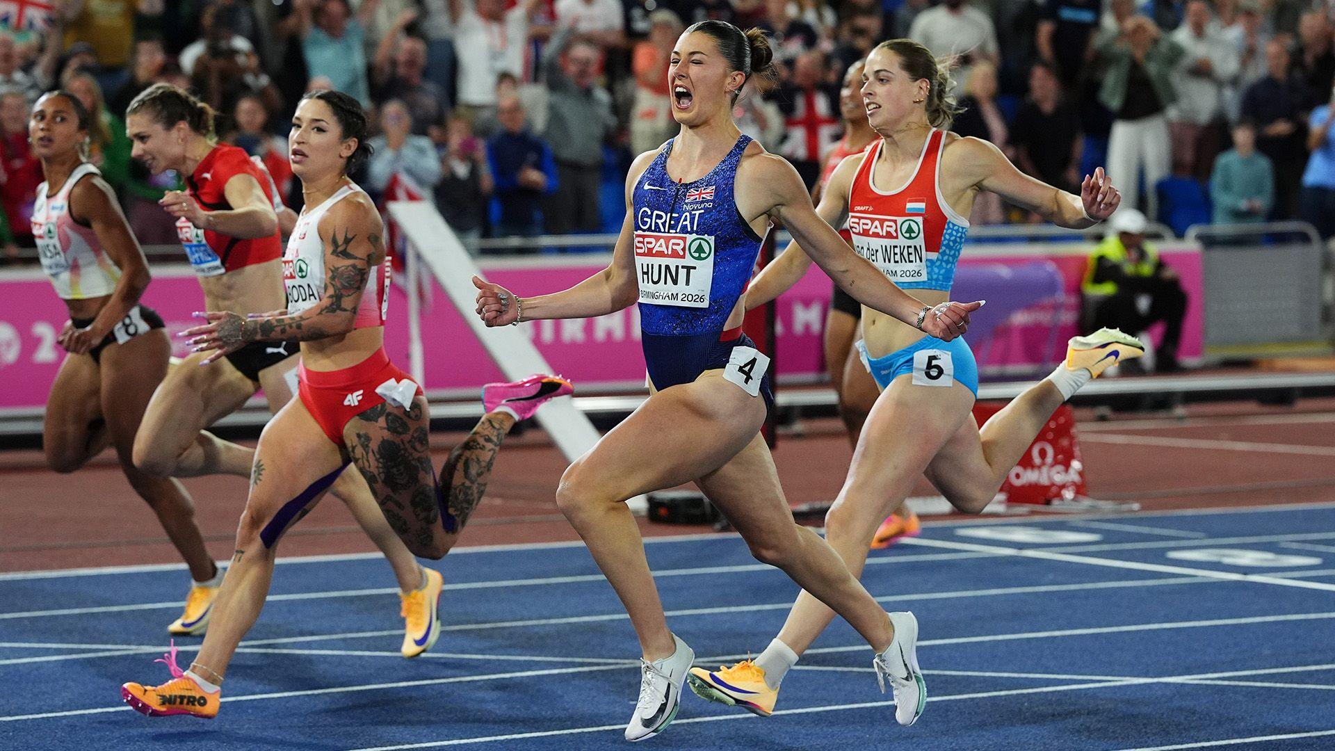 Amy Hunt celebrates as she crosses the finish line ahead of her competitors 