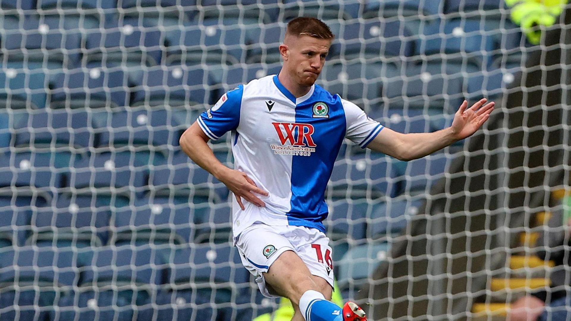 Scott Wharton kicks the ball during a match for Blackburn this season