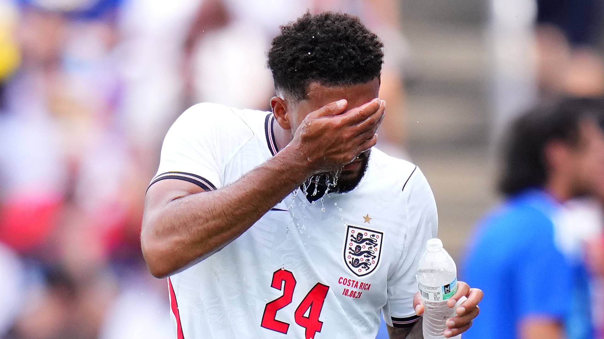 Reece James splashes water on his face