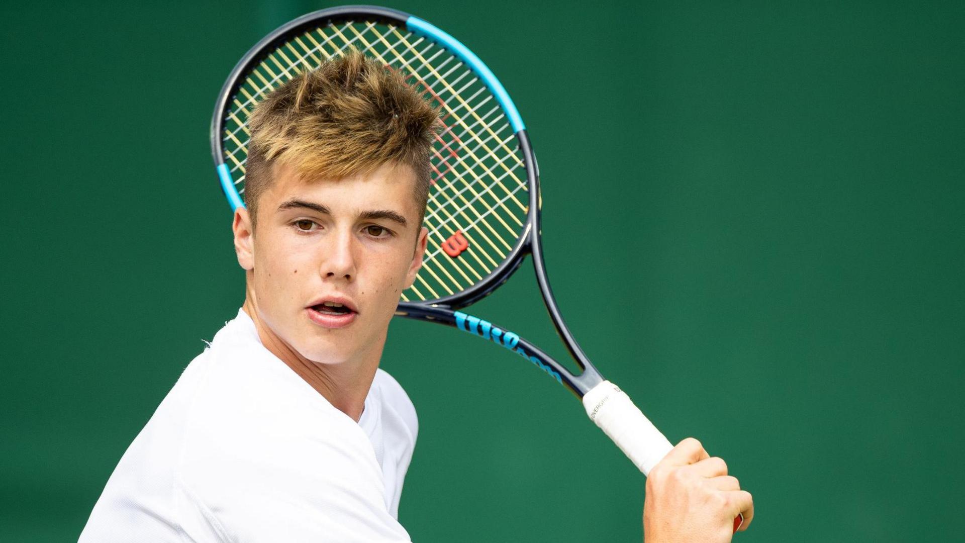 Arthur Fery hits a return at Wimbledon in 2019