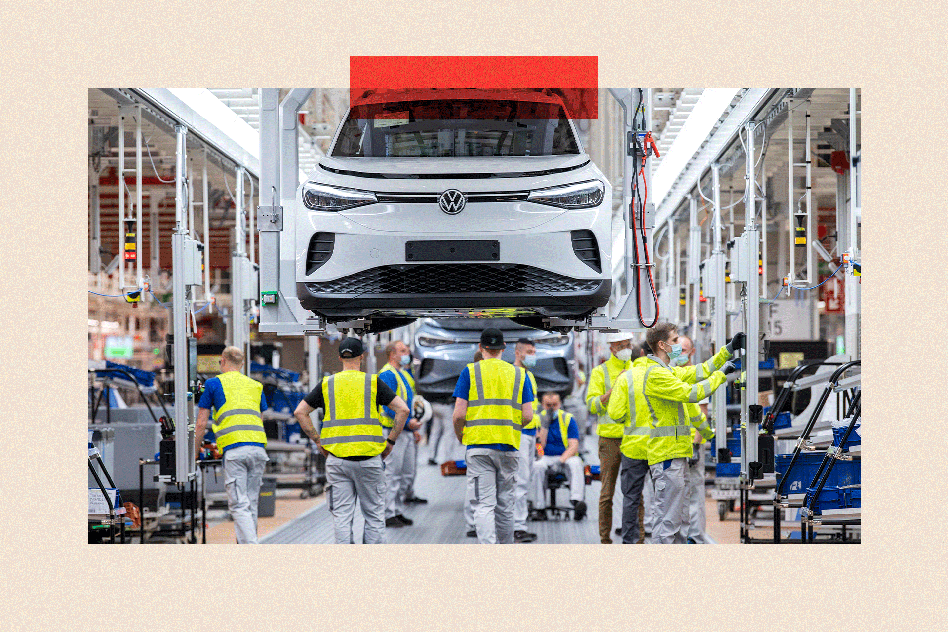 Employees work at the assembly line for the Volkswagen (VW) ID 4 electric car of German carmaker 
