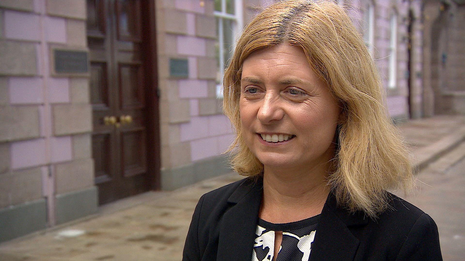 Deputy Lyndsay Feltham stood outside the States Assembly 