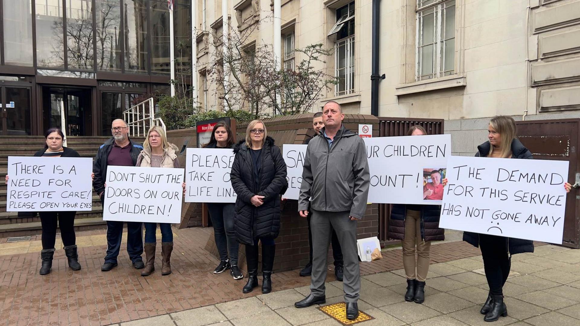 People protesting against the closure of Lavender House, standing outside County Hall in Chelmsford