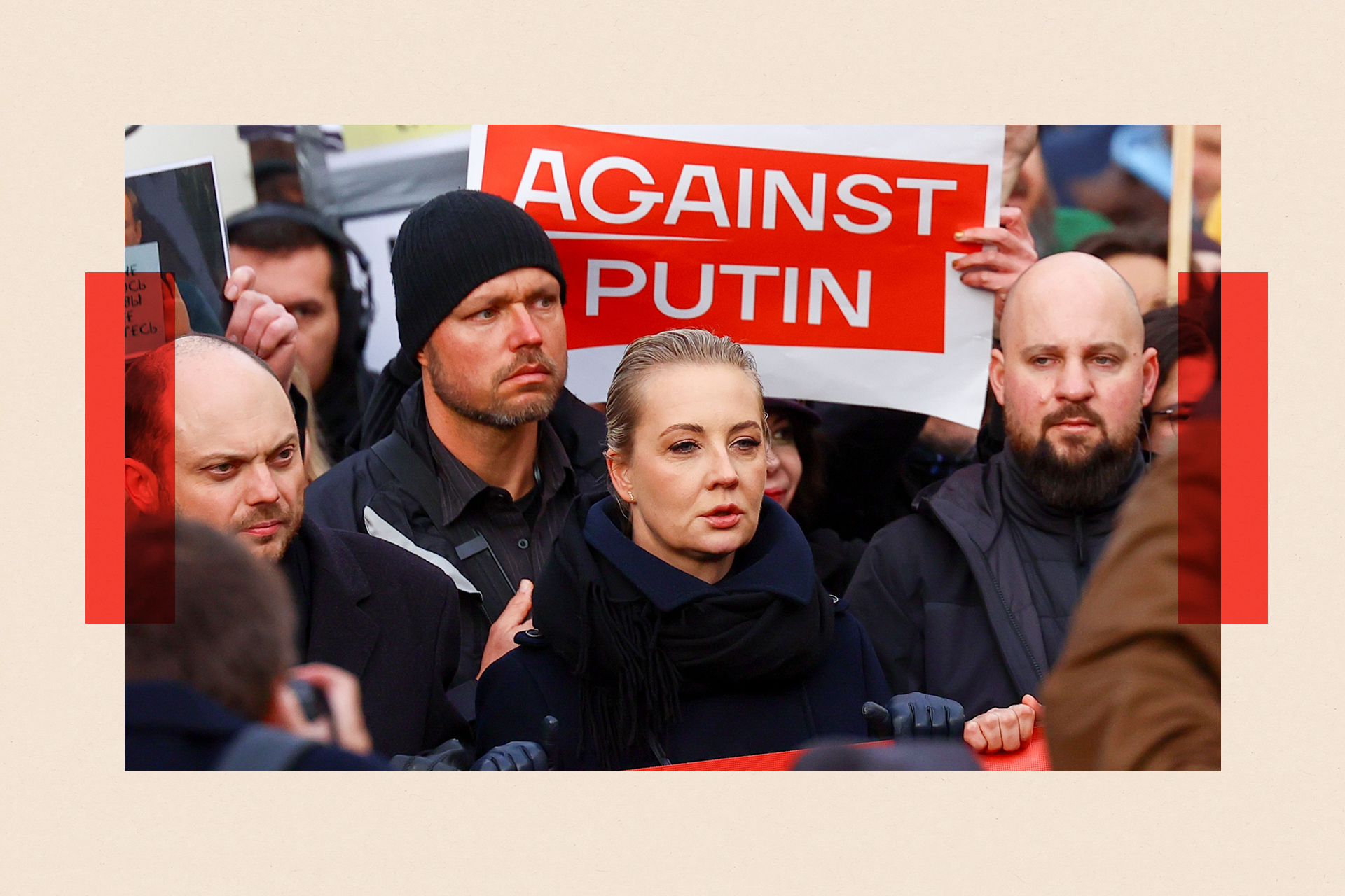 Vladimir Kara-Murza (L) and Yulia Navalnaya (C) attend an anti-war demonstration in Berlin, Germany and stand in front of a poster that reads 'Against Putin'.