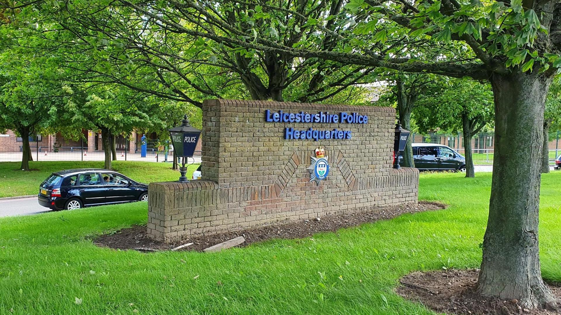 A brickwork sign at the entrance to the police's Force HQ