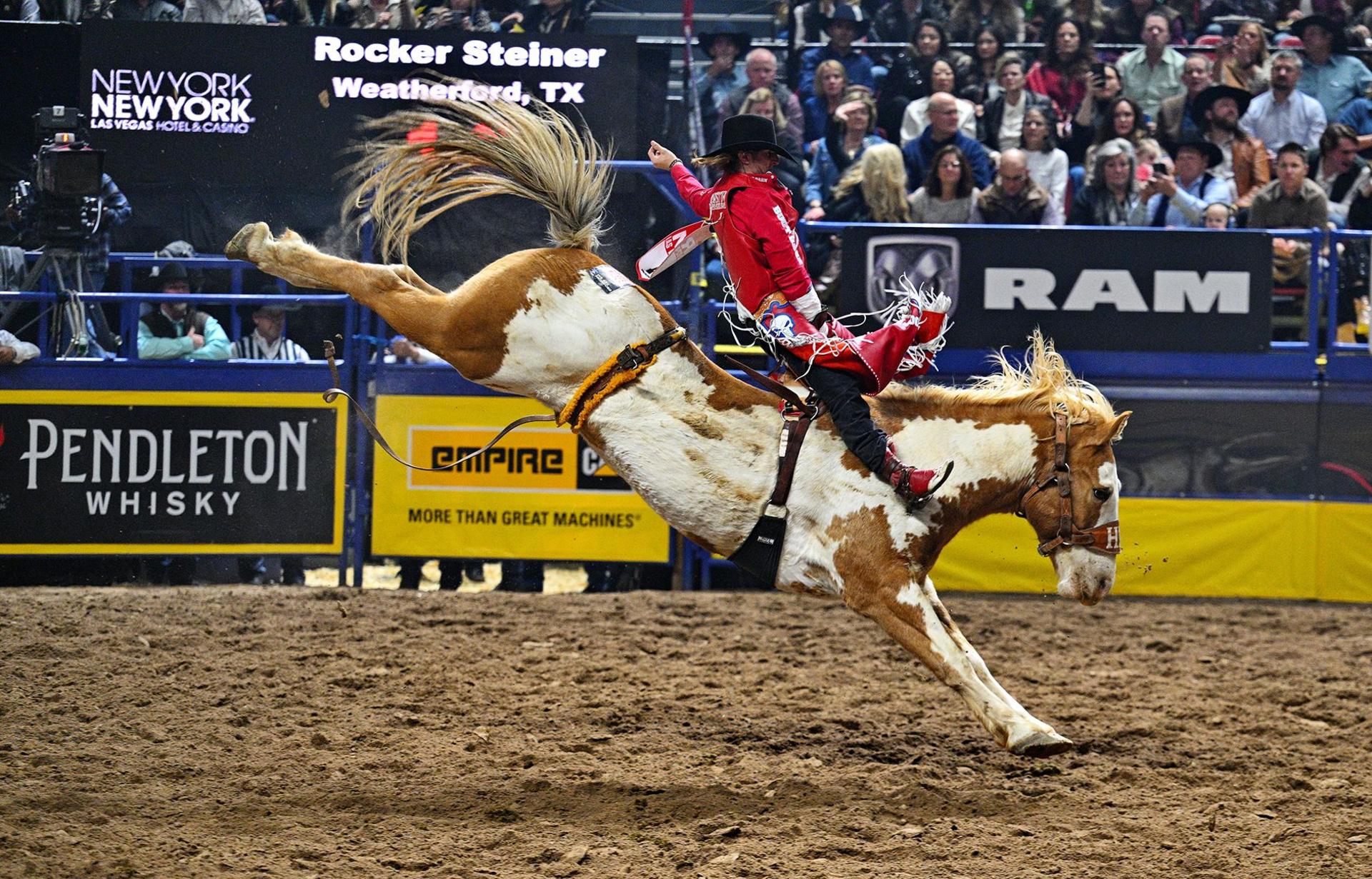 Bareback rider Rocker Steiner rides Bishop of Hi Lo Pro Rodeo during the Annual Wrangler National Finals Rodeo at the Thomas & Mack Center in Las Vegas