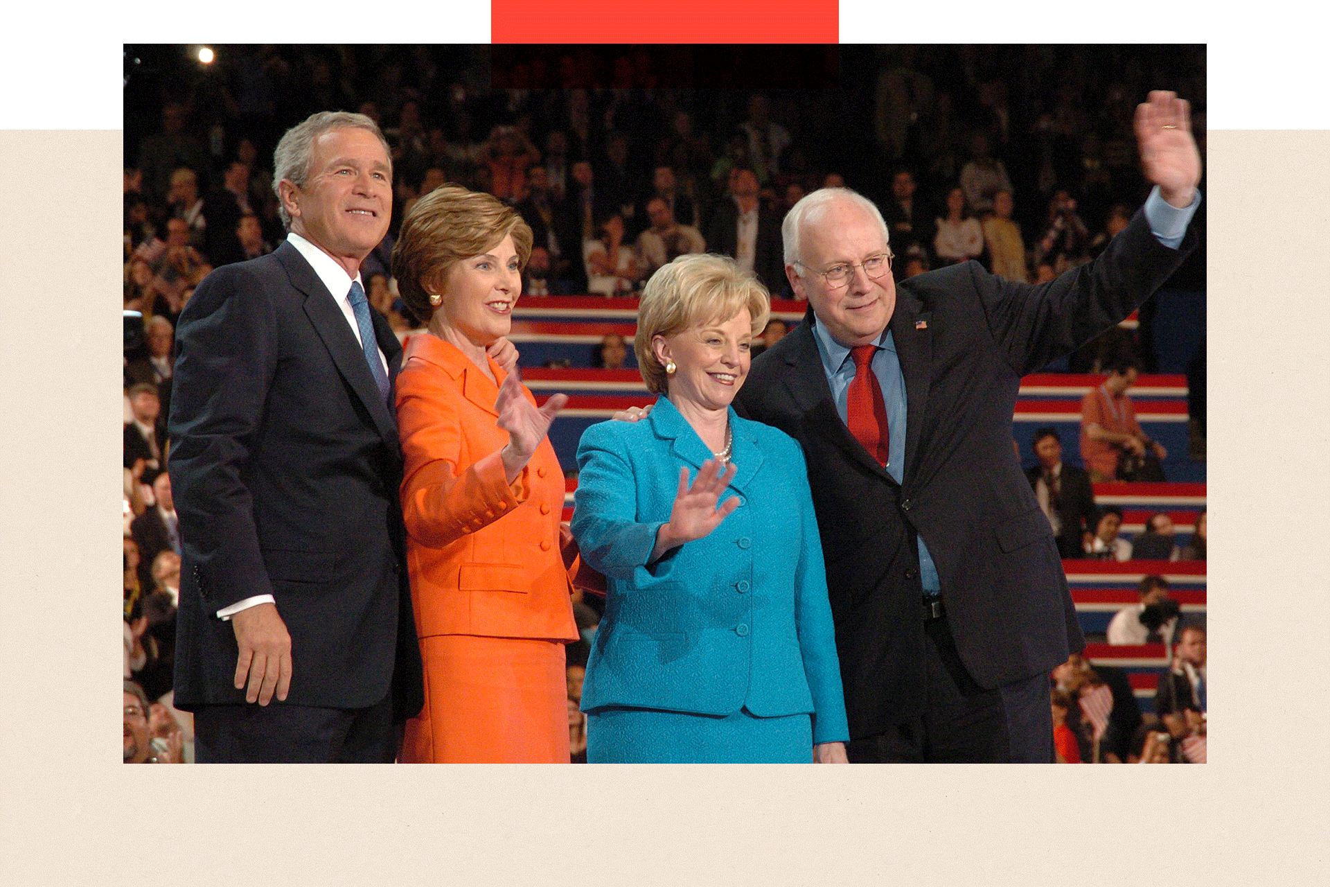George Bush, Laura Bush, Dick Cheney, and Lynne Cheney stand on a stage waving.