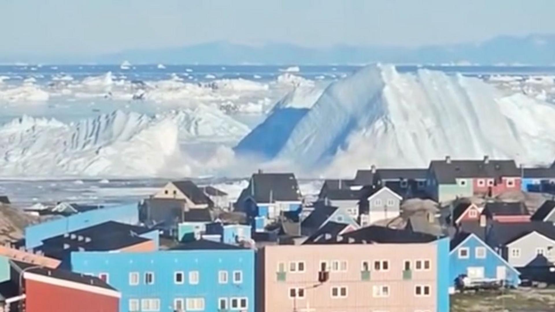 Watch: Giant iceberg turns over near Greenland's coast