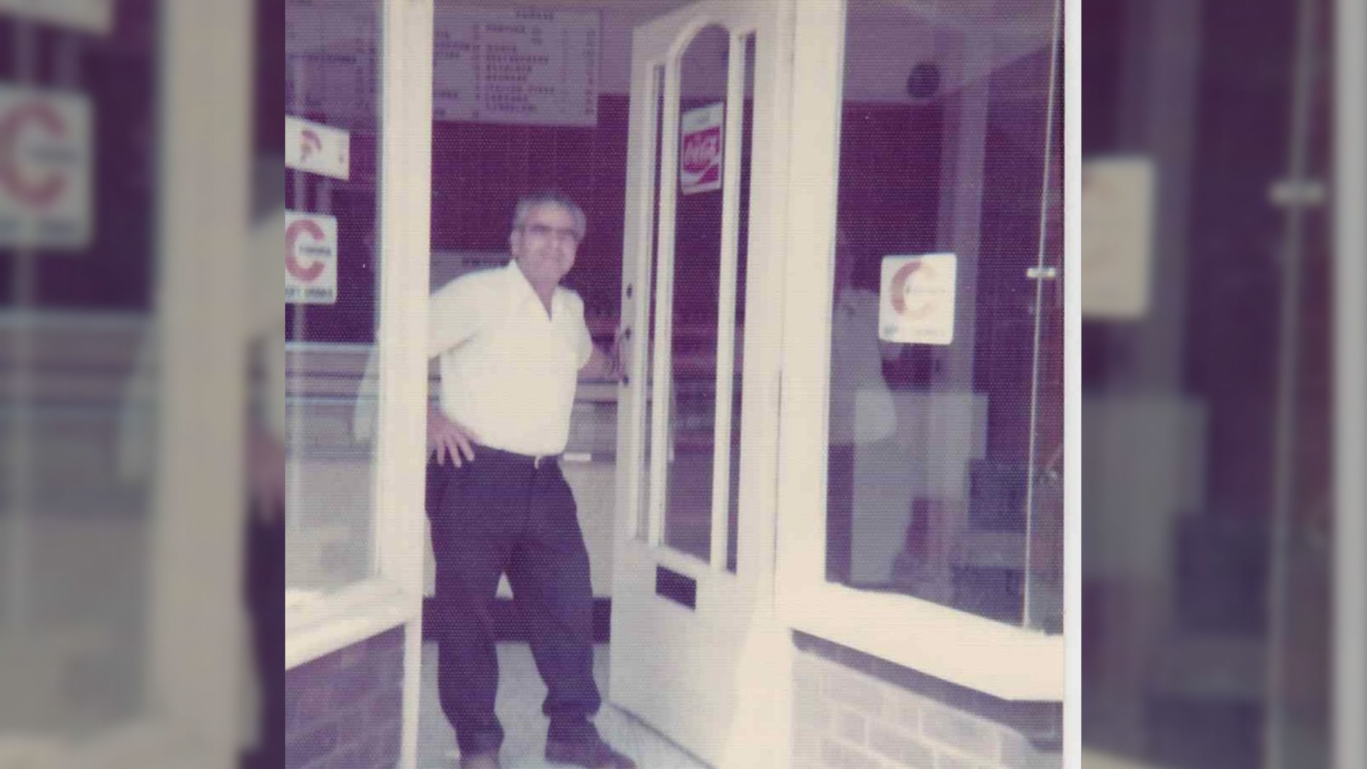 Mr Konstandi's dad, George, stood in the doorway of the newly opened chippy in 1975