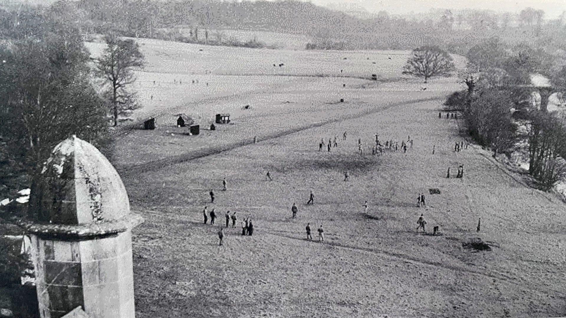 A photo of American soldiers playing baseball on the front lawn of Killymoon Castle