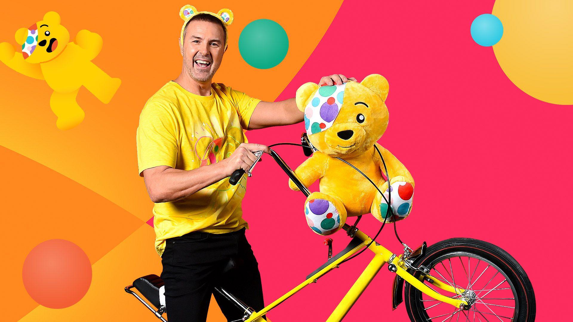 Paddy McGuinness on a retro bike with Pudsey Bear, ahead of his Ultra Endurance Cycle Challenge for BBC Children in Need