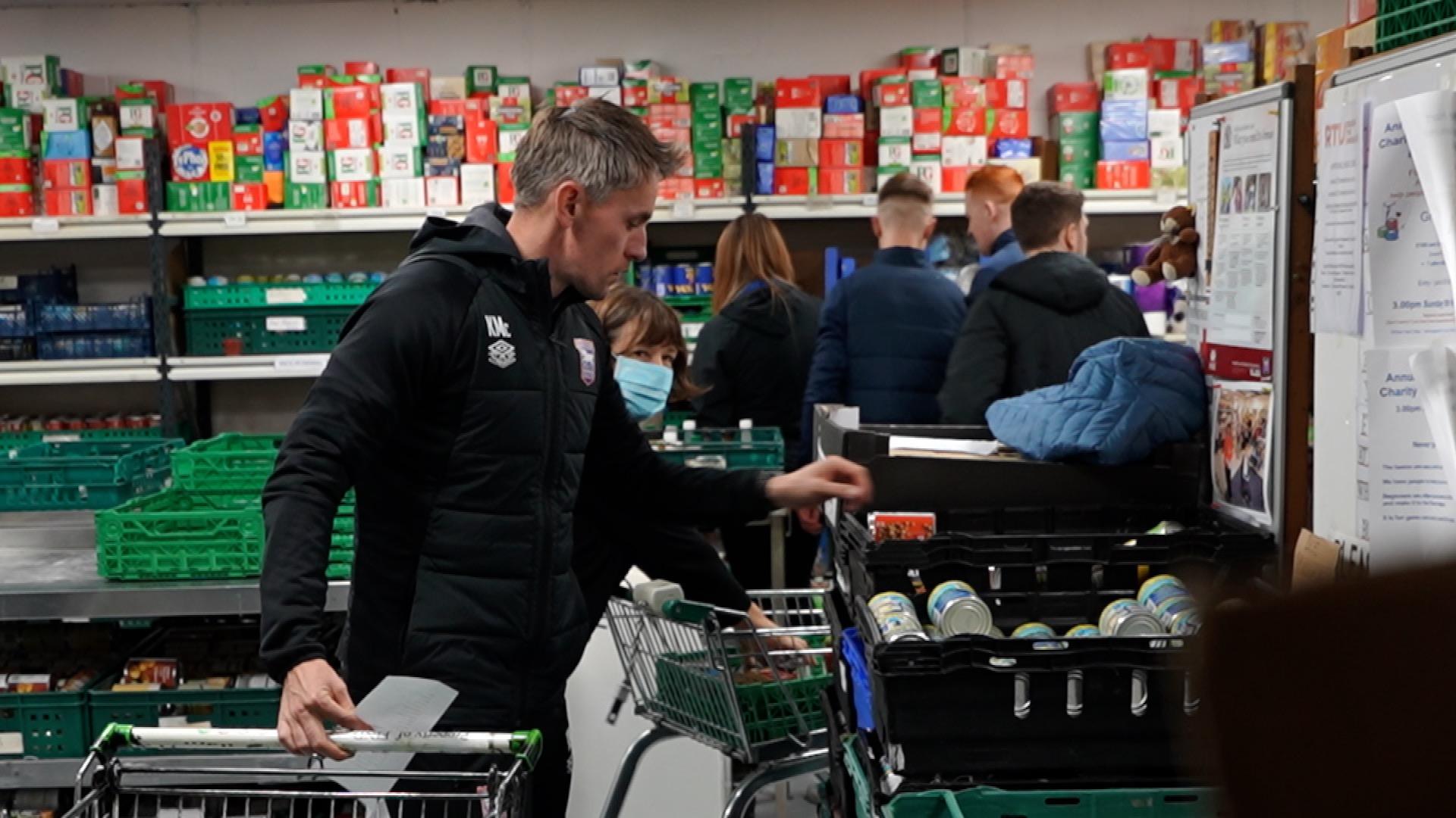 Kieran McKenna helping at an Ipswich charity 