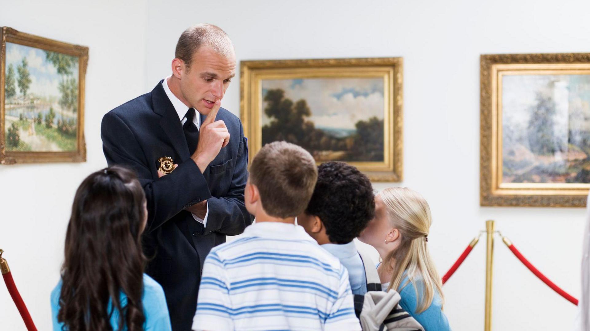 Children being told to be quiet at museum