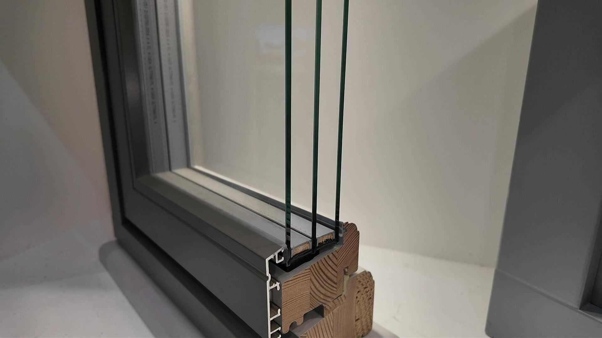 A simple shot of a triple glazed window cut in half so you can see all three panes of glass. Housed in a display cabinet, the exhibit is designed to show how triple glazed windows can reflect sun back into the atmosphere to stop homes over heating