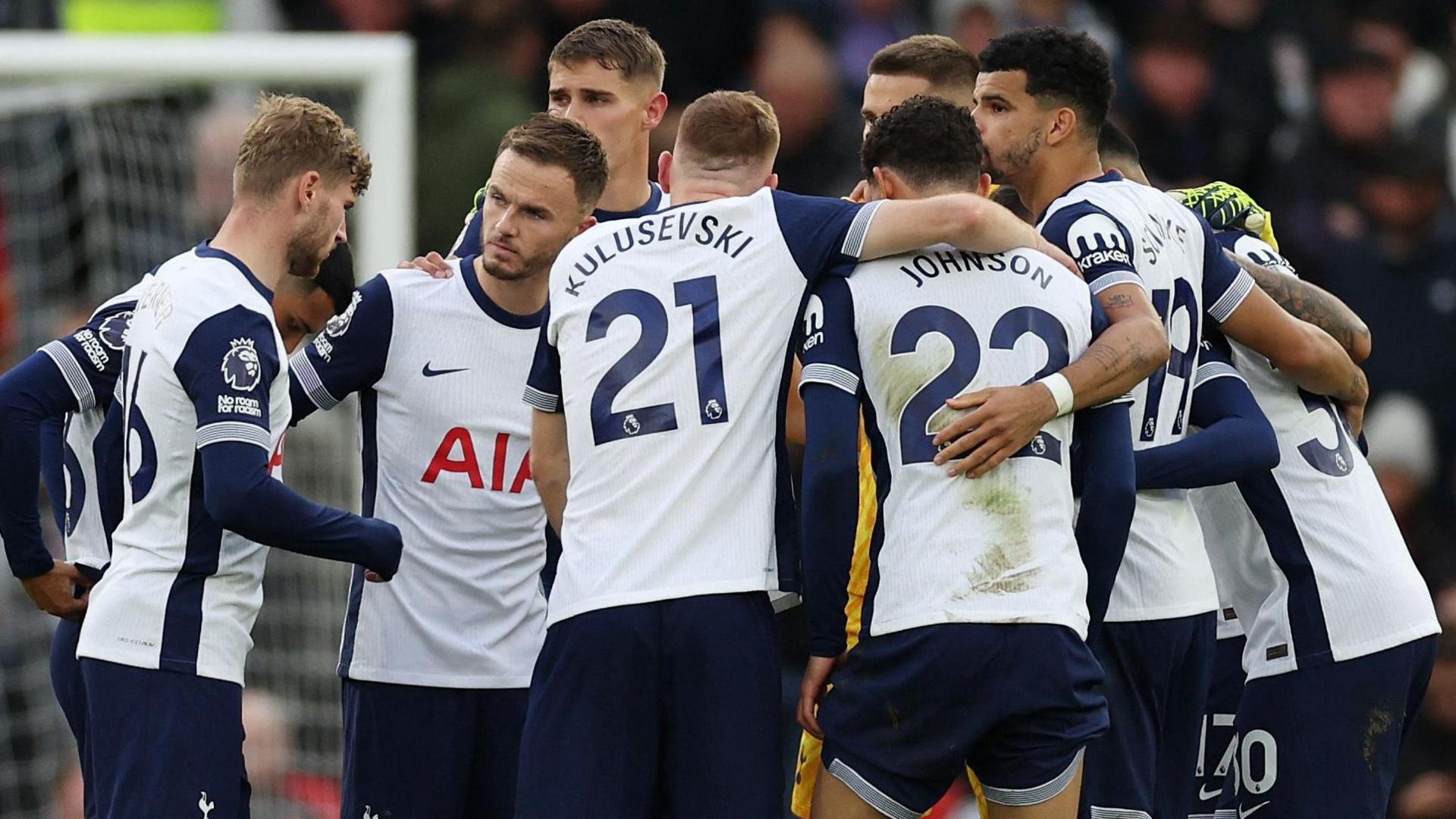 Tottenham players form a huddle during their win at Manchester United in September 2024