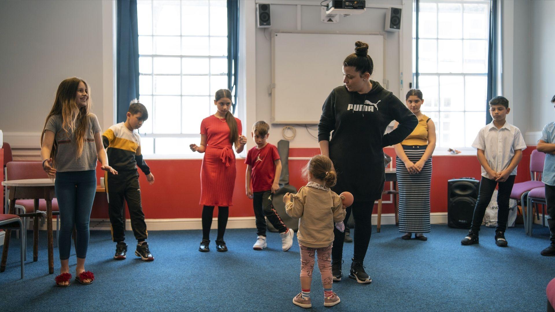 Roma families who will be part of the performance in Bradford practicing