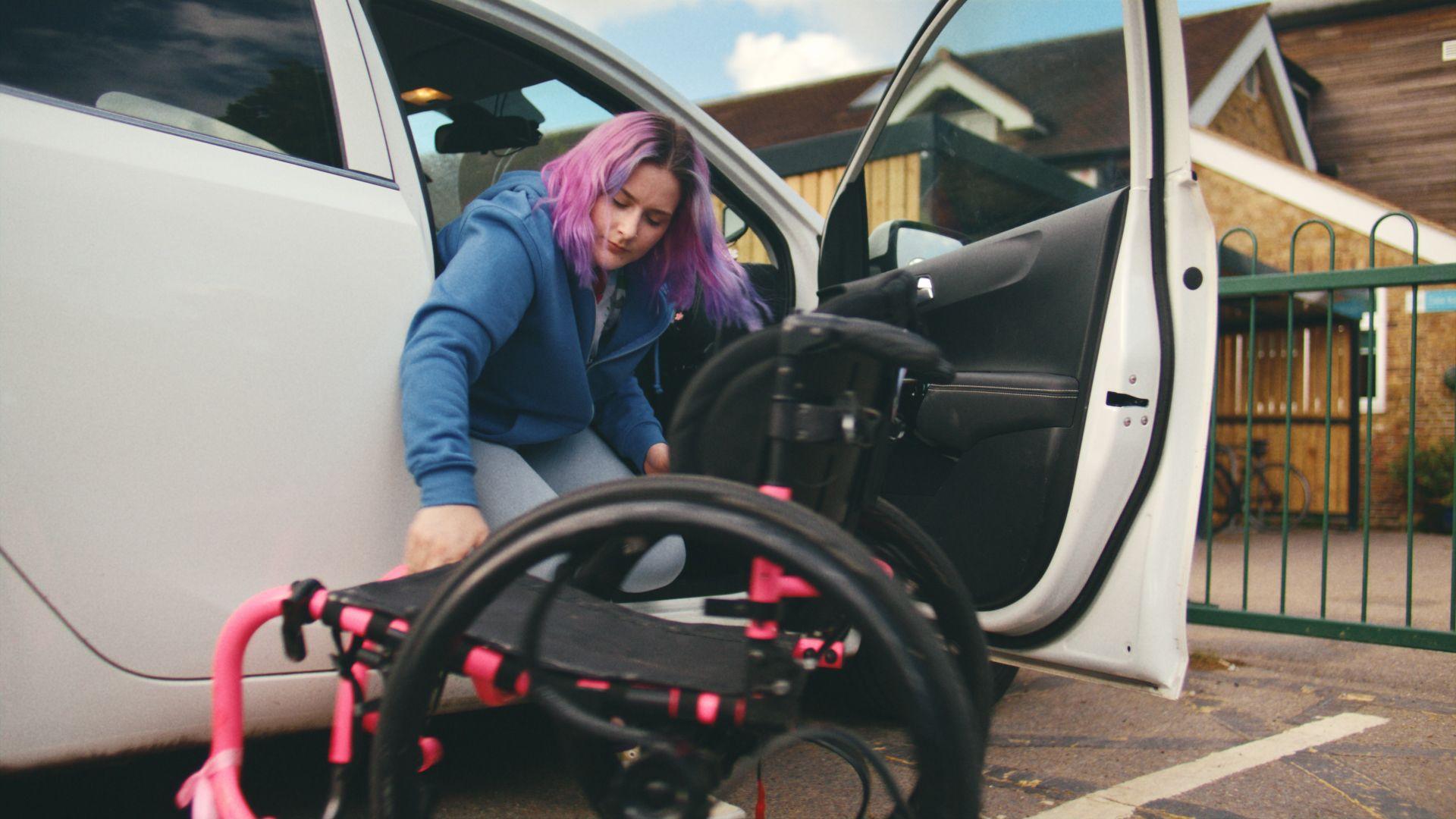Sonny, pictured getting out of her car and into her wheelchair, was recently fitted for a specialist rugby chair, and the cost was around £8,000