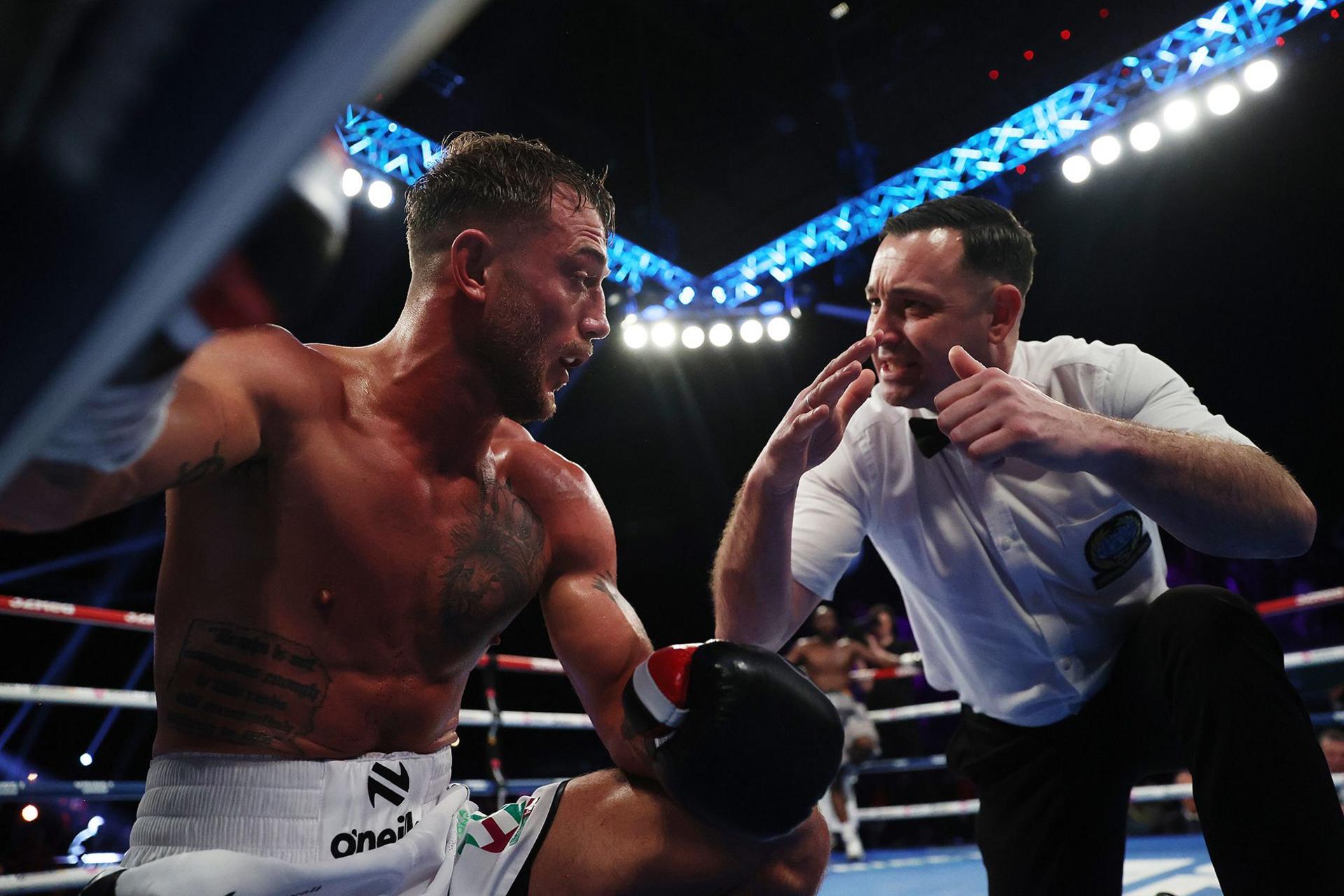 Referee Kieran McCann delivers a count to Brad Pauls during his British, EBU European, WBA Continental and WBO International middleweight title fight against Denzel Bentley at OVO Arena Wembley