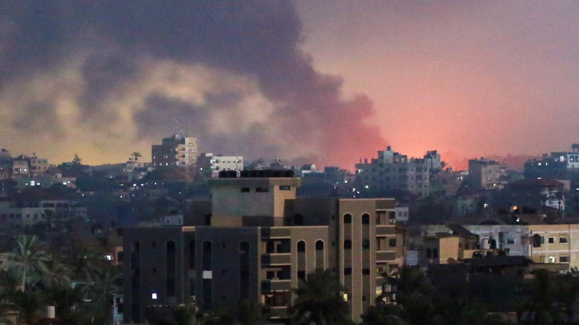 This picture taken from Deir al-Balah in the central Gaza Strip shows smoke billowing over the horizon, east of the city of Al-Zawaida, following Israeli bombardment at dawn on August 17, 2024, amid the ongoing conflict between Israel and the Palestinian militant group Hamas.