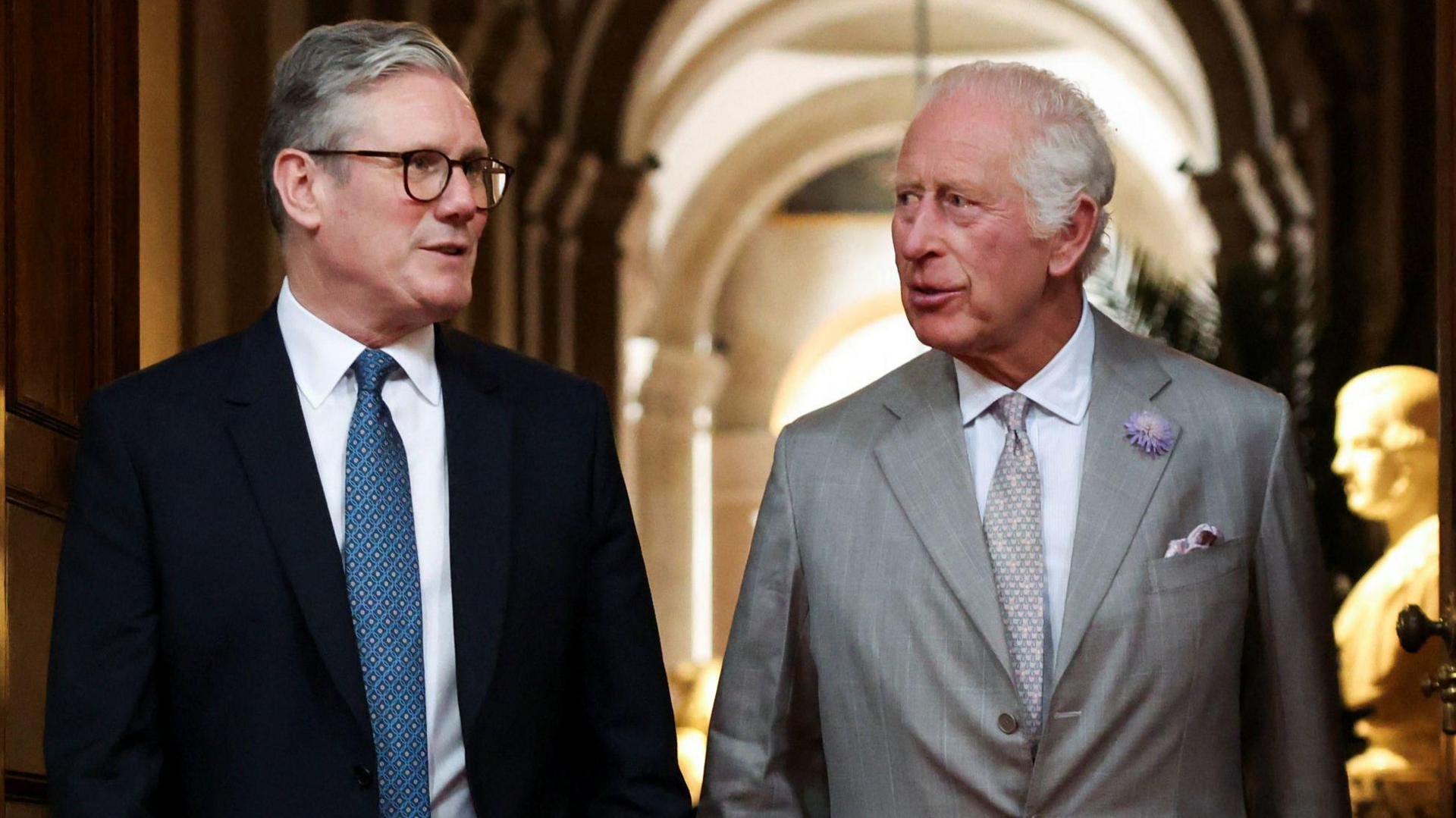 A file photo of Prime Minister Sir Keir Starmer and King Charles walking through Blenheim Palace together in July