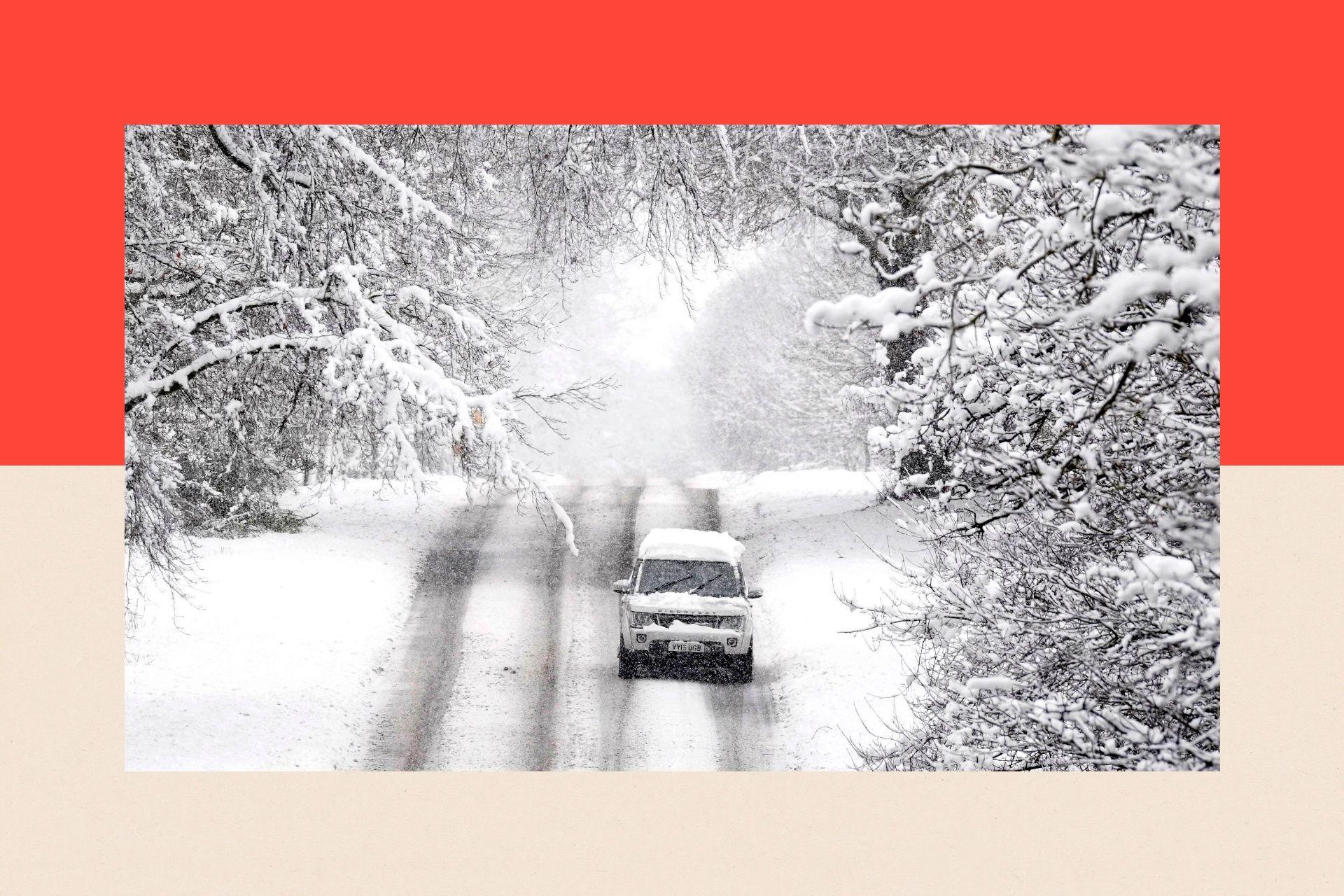 A vehicle is driven along a snow covered road in Scotton, Harrogate, North Yorkshire.