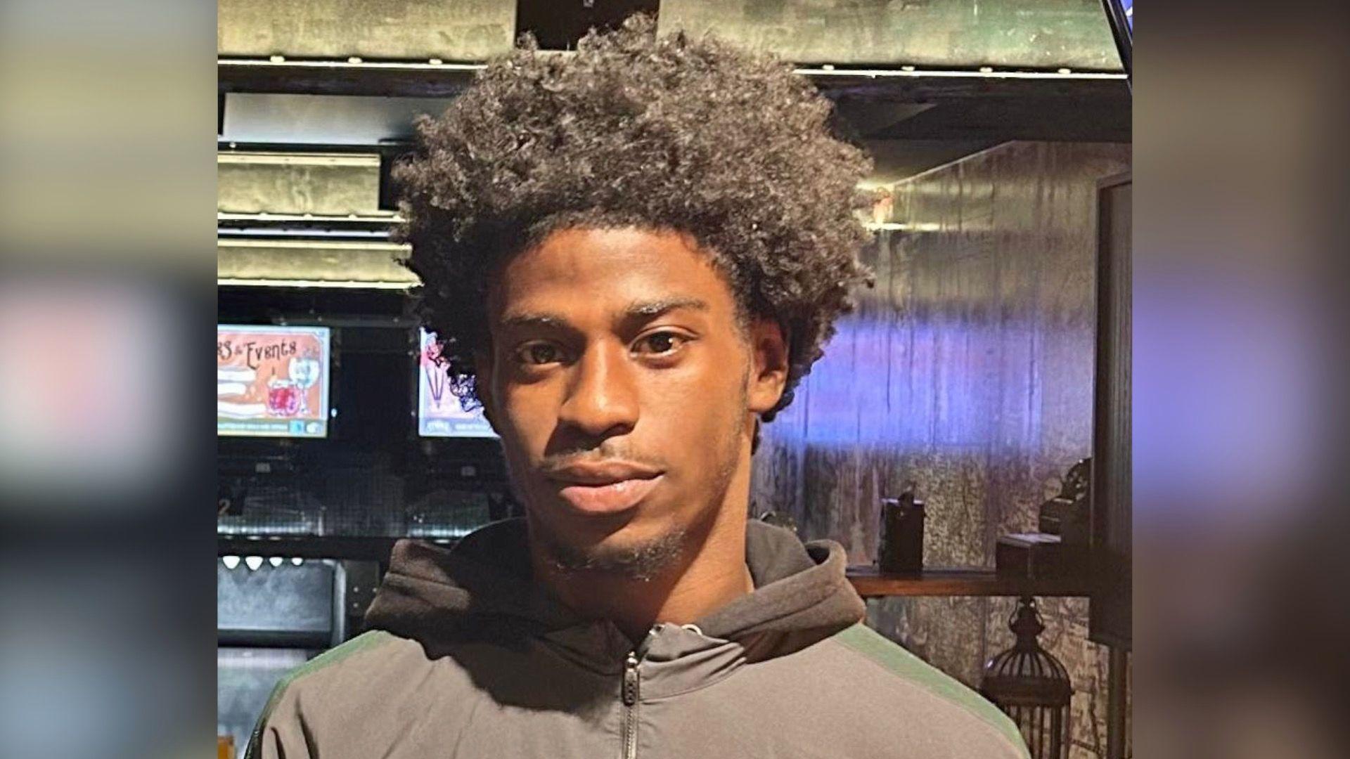 Rinneau Perrineau is looking at the camera wearing a neutral expression