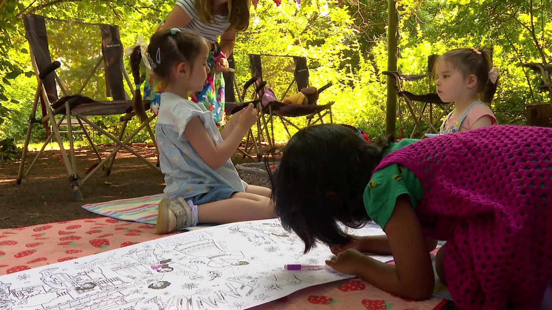 Three children playing outdoors