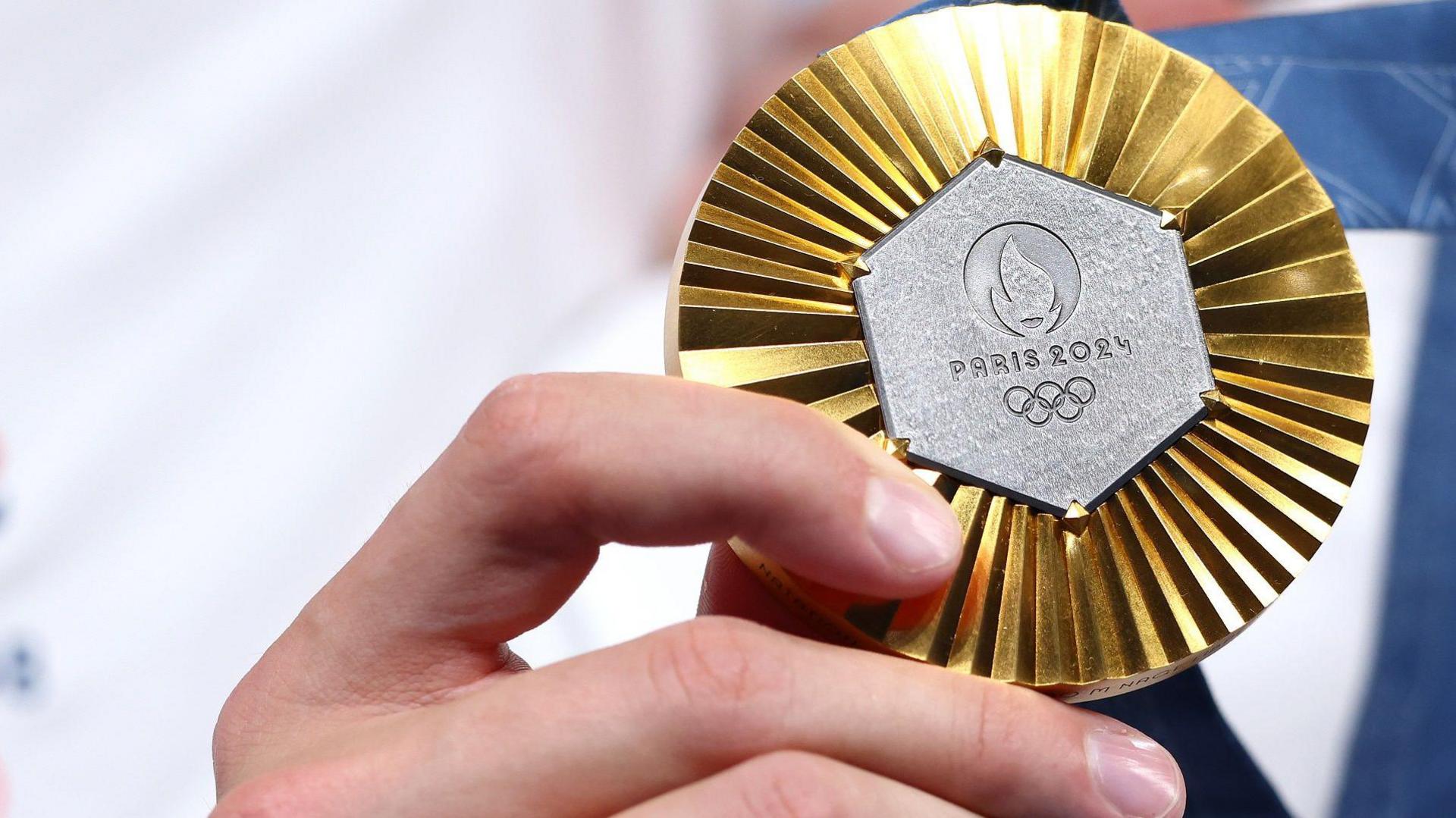 An image of a Paris 2024 Olympic medal