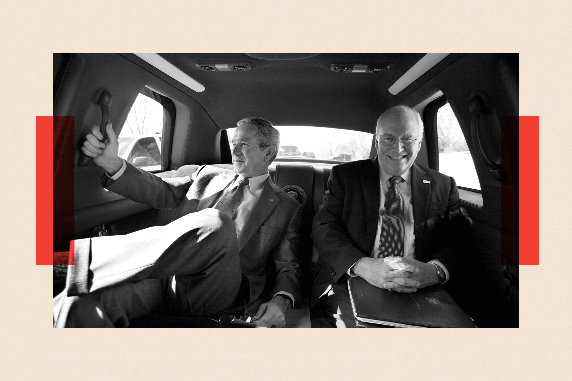 A black-and-white photo of George Bush and Dick Cheney in the back of a taxi