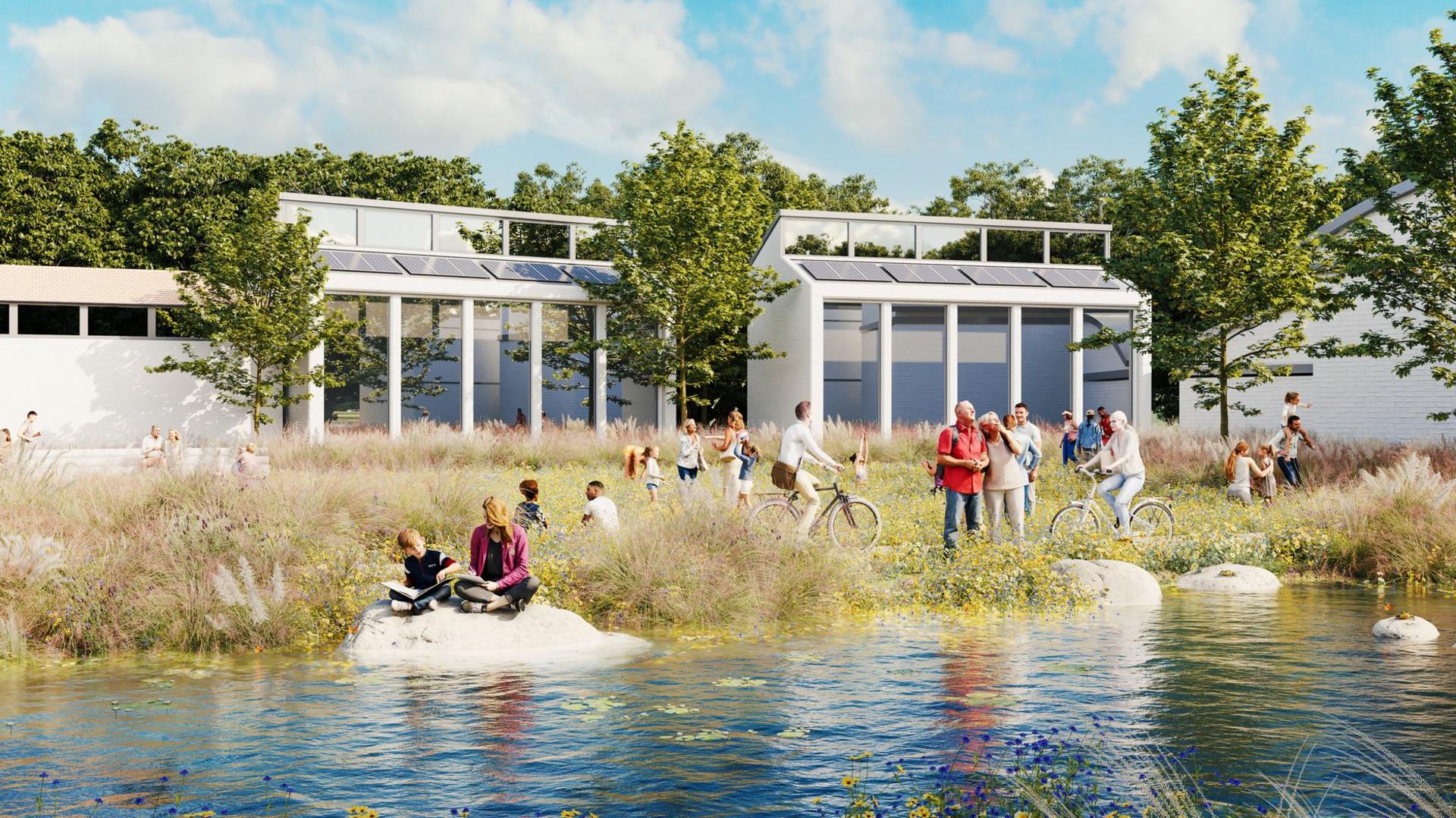 An artists CGI mock-up of Salt Cross garden village. It depicts modern white buildings overlooking a green open space with a pond in the middle.