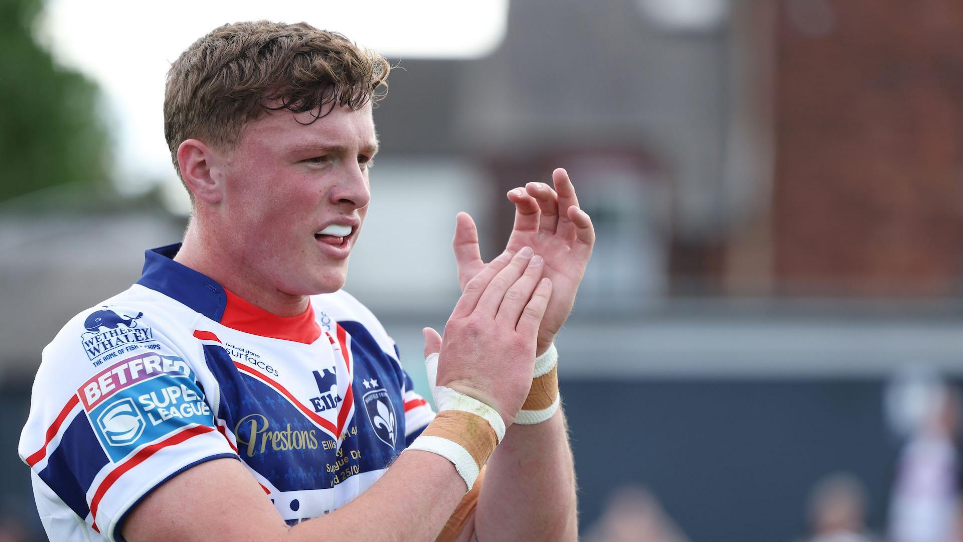 Ellis Lingard applauds after Wakefield's win against Salford this season