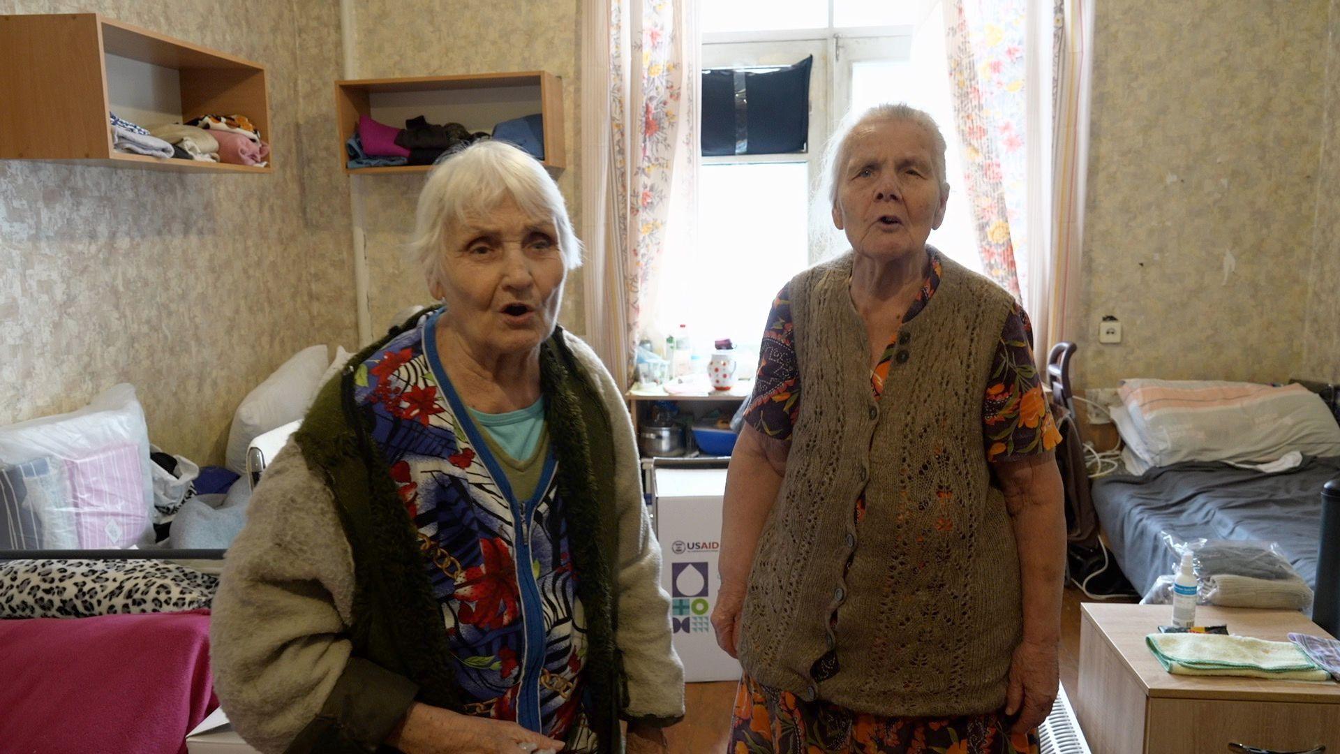 Valentyna and Mariia, two elderly displaced women, are pictured in temporary accommodation