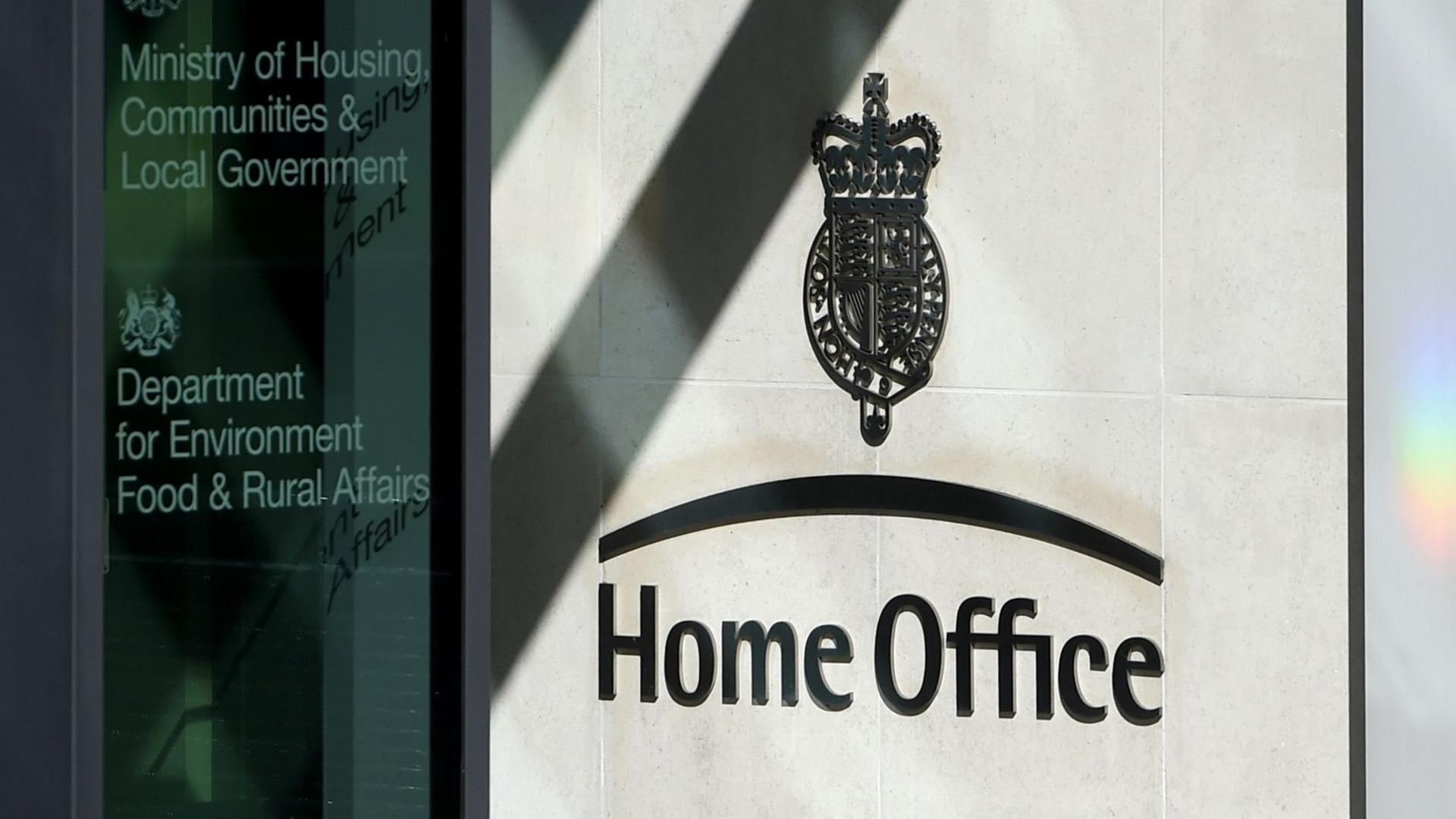 A sign saying 'Home Office' is seen to an entrance to the Home Office building in London