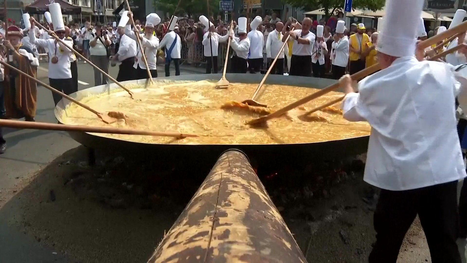 A huge pan filled with eggs. 