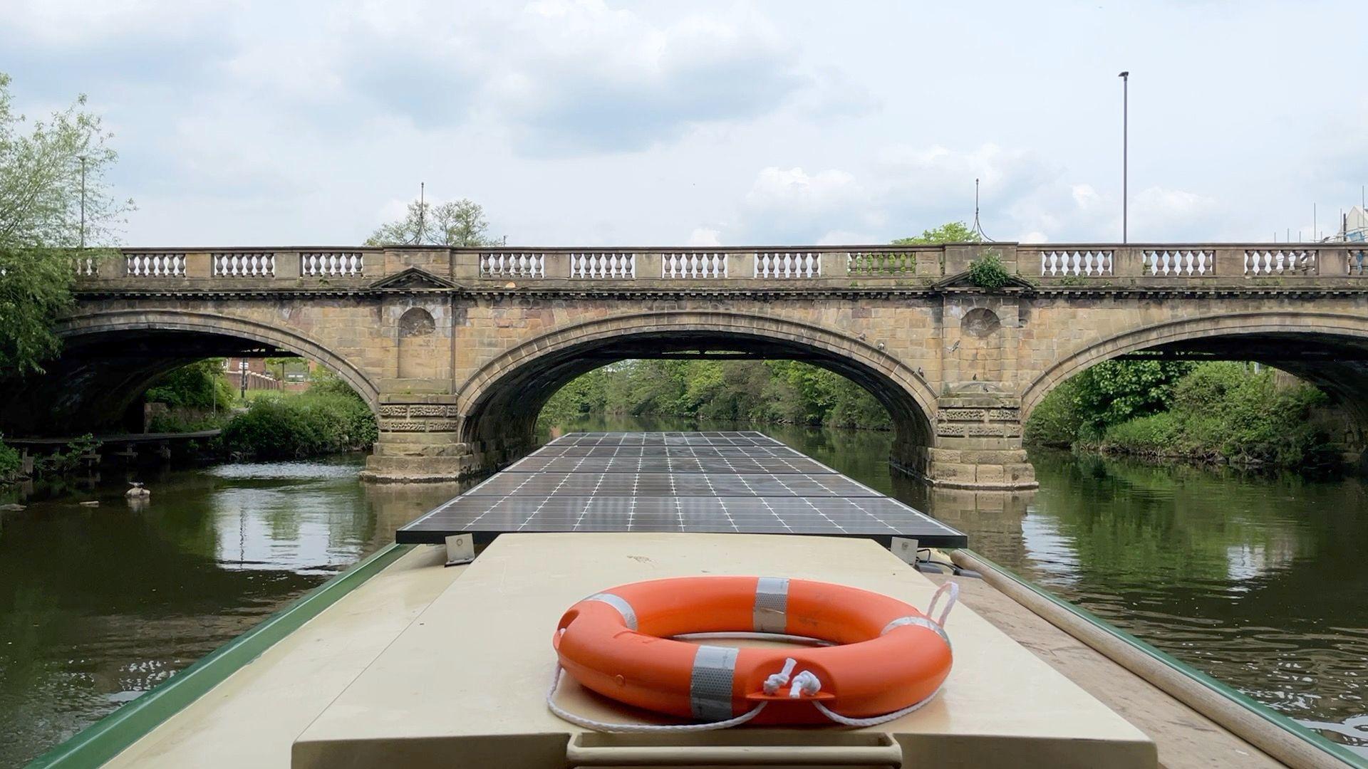 Boat going under bridge in Derby city centre