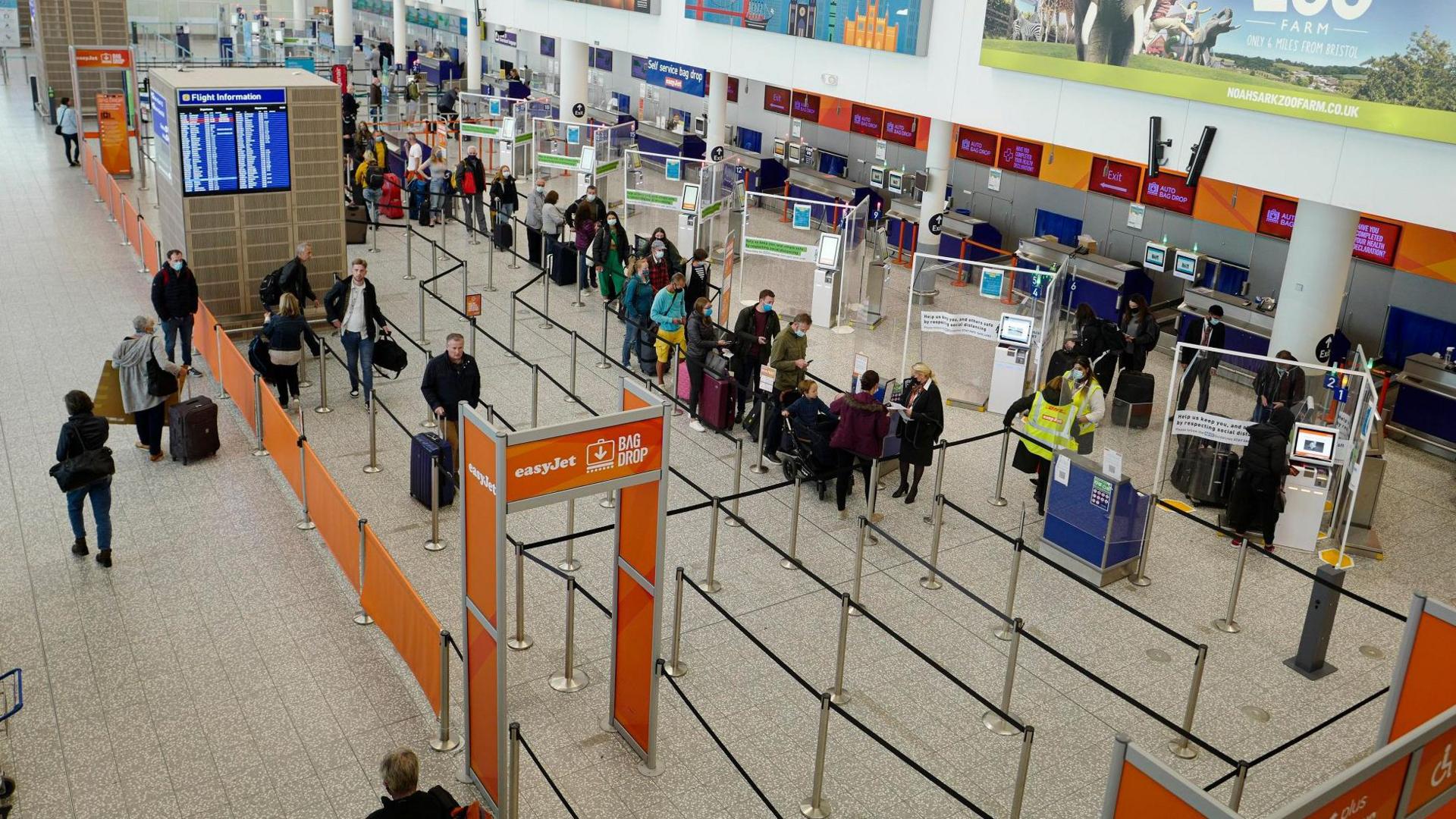 A queue at the EasyJet desk in the check in hall at Bristol Airport