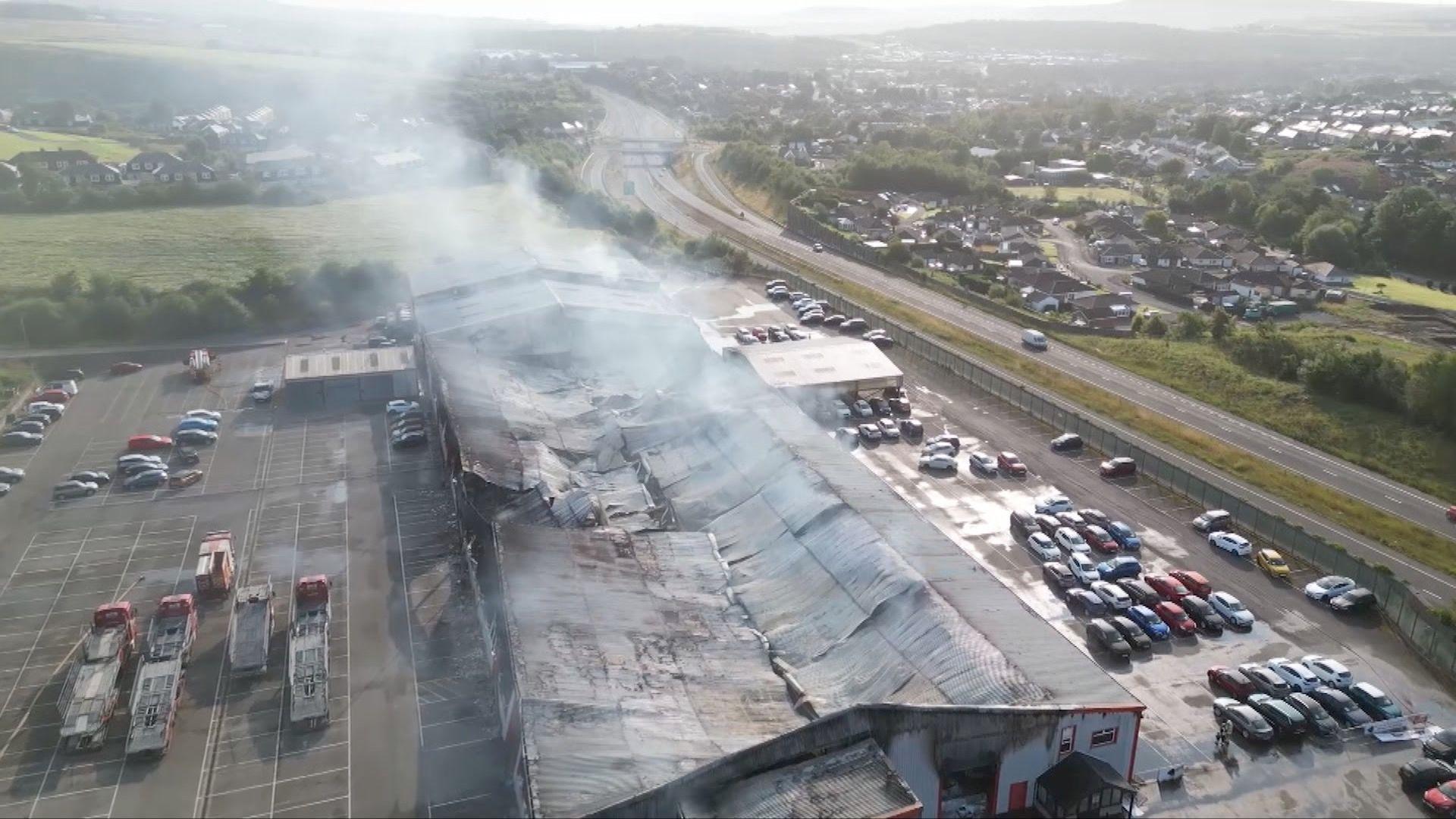 Destroyed building with smoke rising