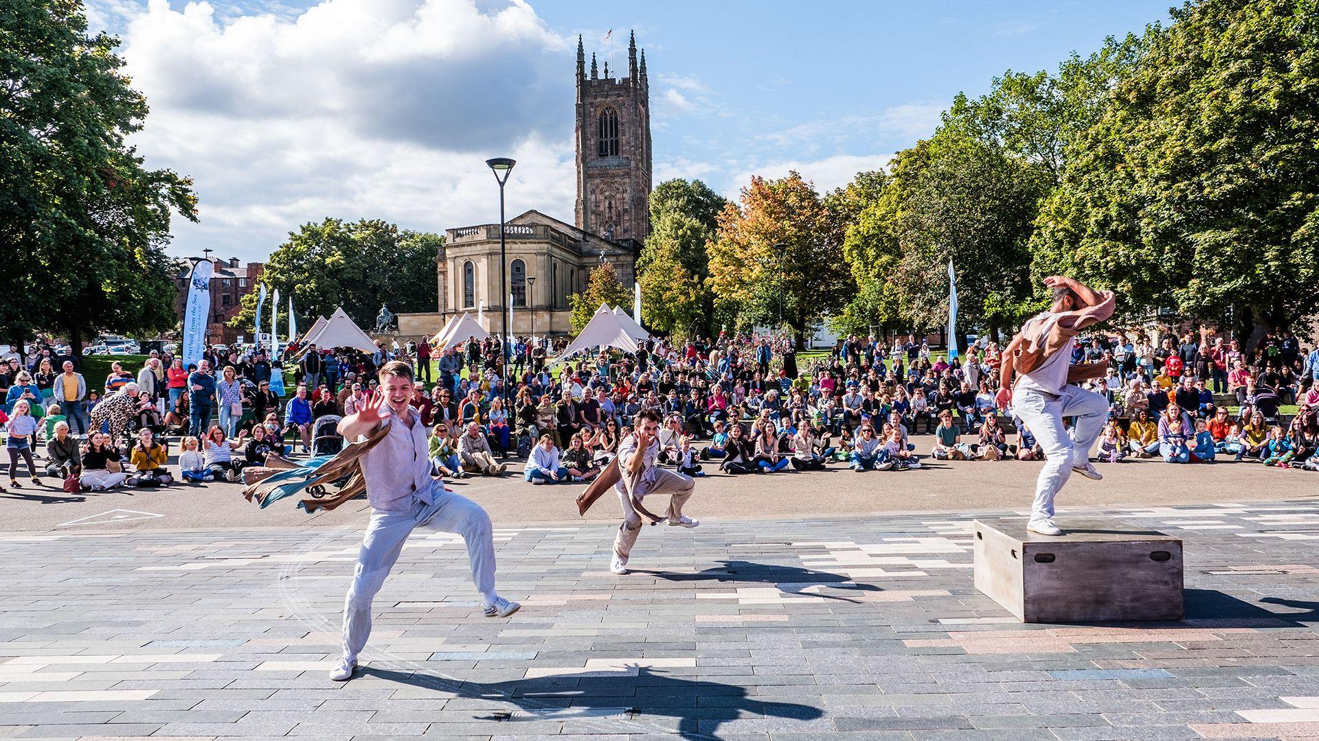 Dancers in Derby performing at Derby Feste with a large crowd watching