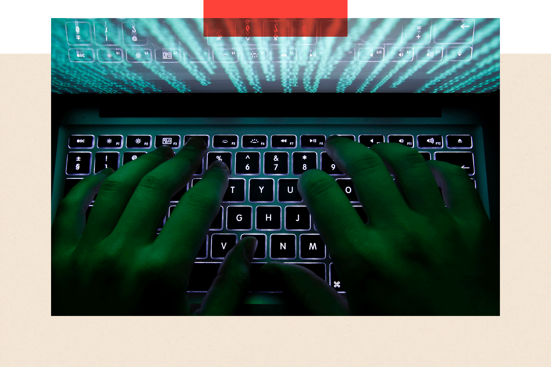 A man types on a computer keyboard