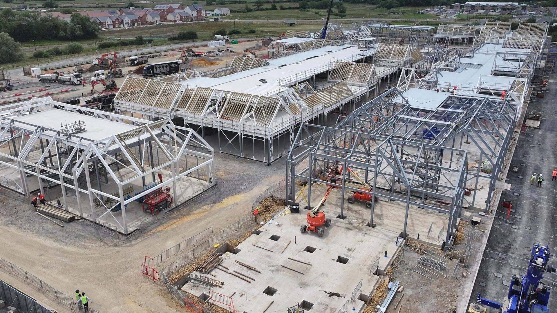 Steel frames on a construction site for Cotswolds Designer Outlet