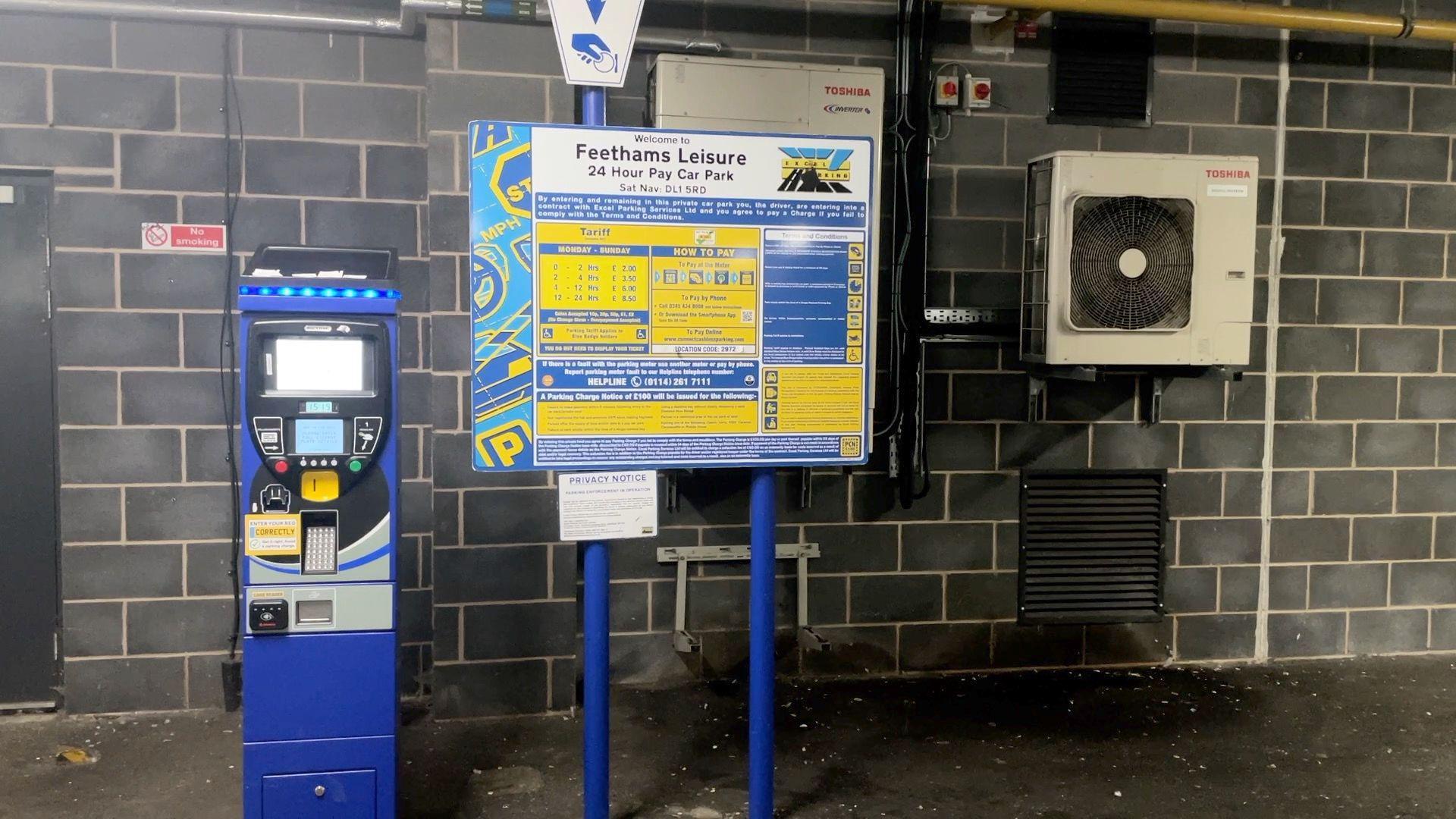 Payment machine and information board at an Excel car park in Darlington