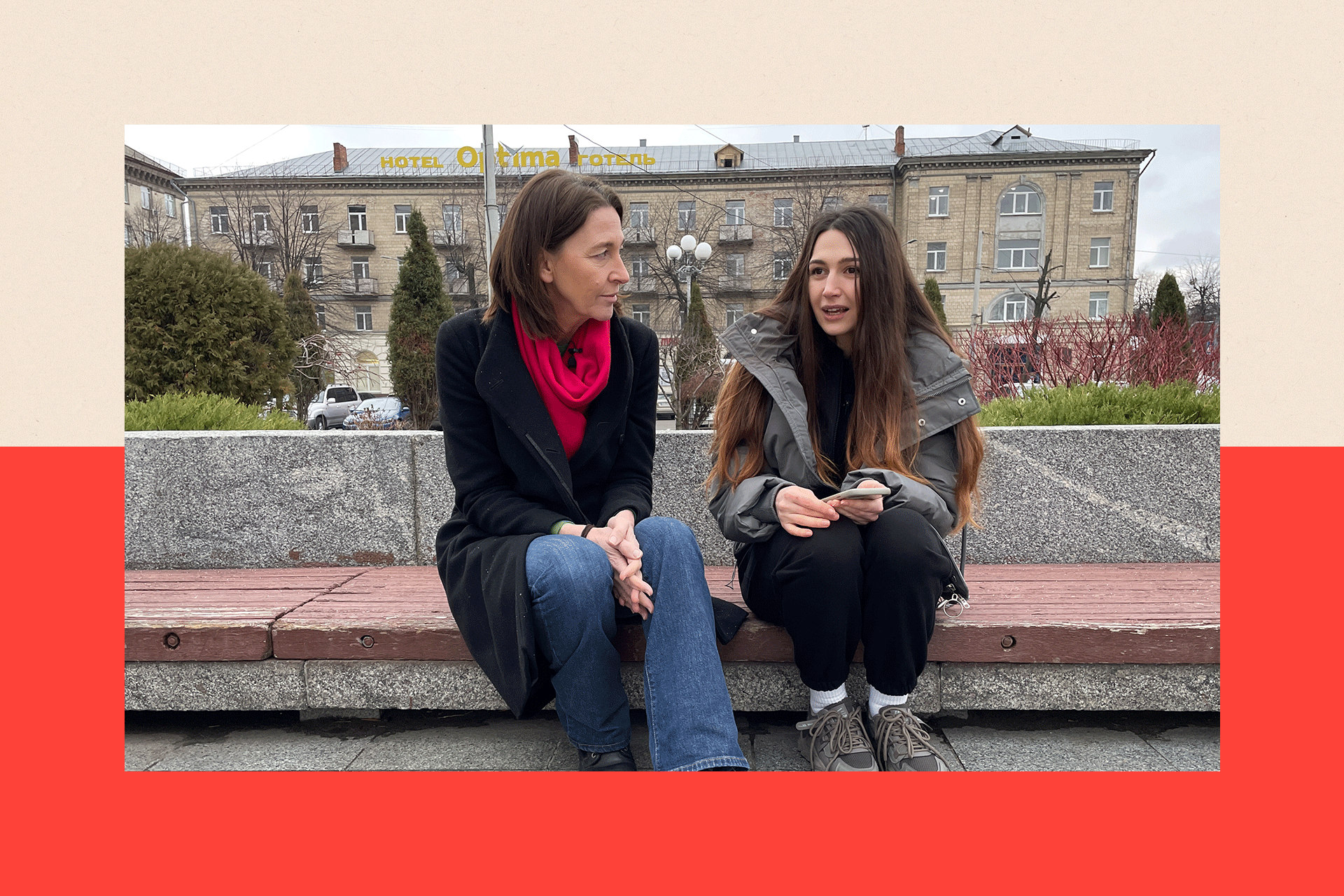 Lyudmila and Sarah sit outside and talk
