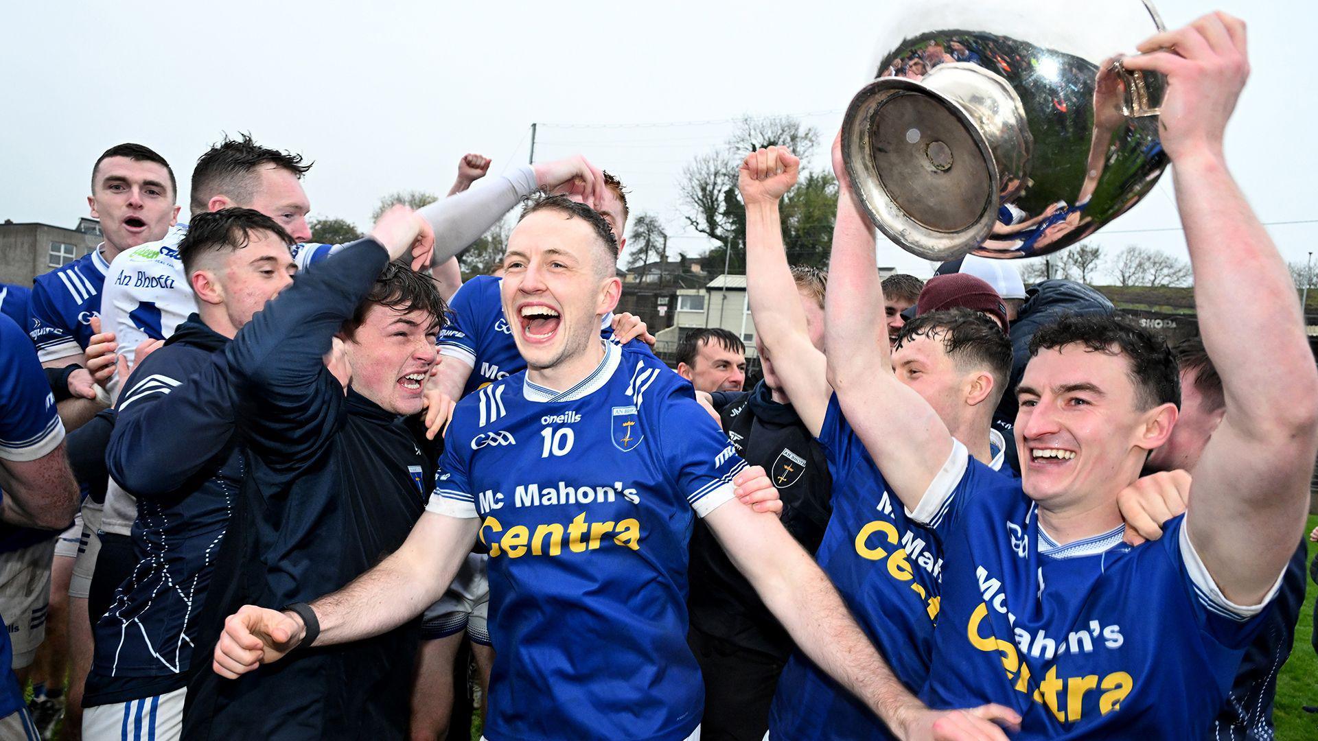 Scotstown players celebrate lifting the title