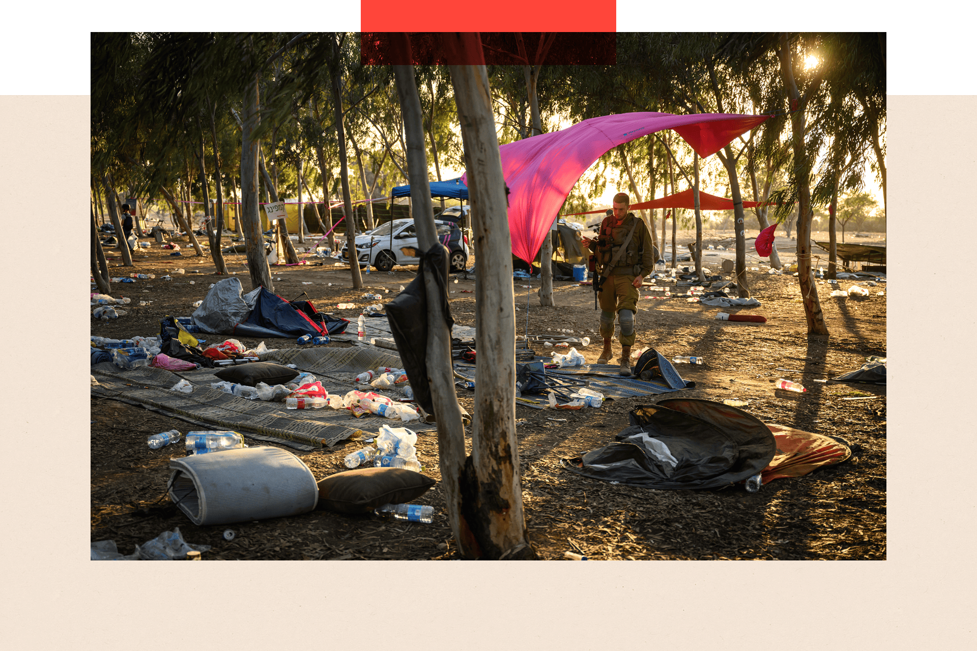 Members of the security forces search for identification and personal effects at the Nova Music Festival site