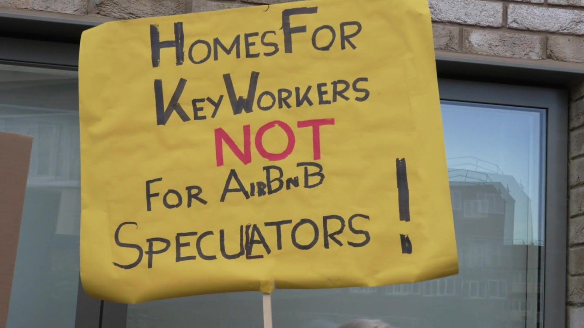 Banner which says: "Homes for Key workers not for Airbnb speculators!"