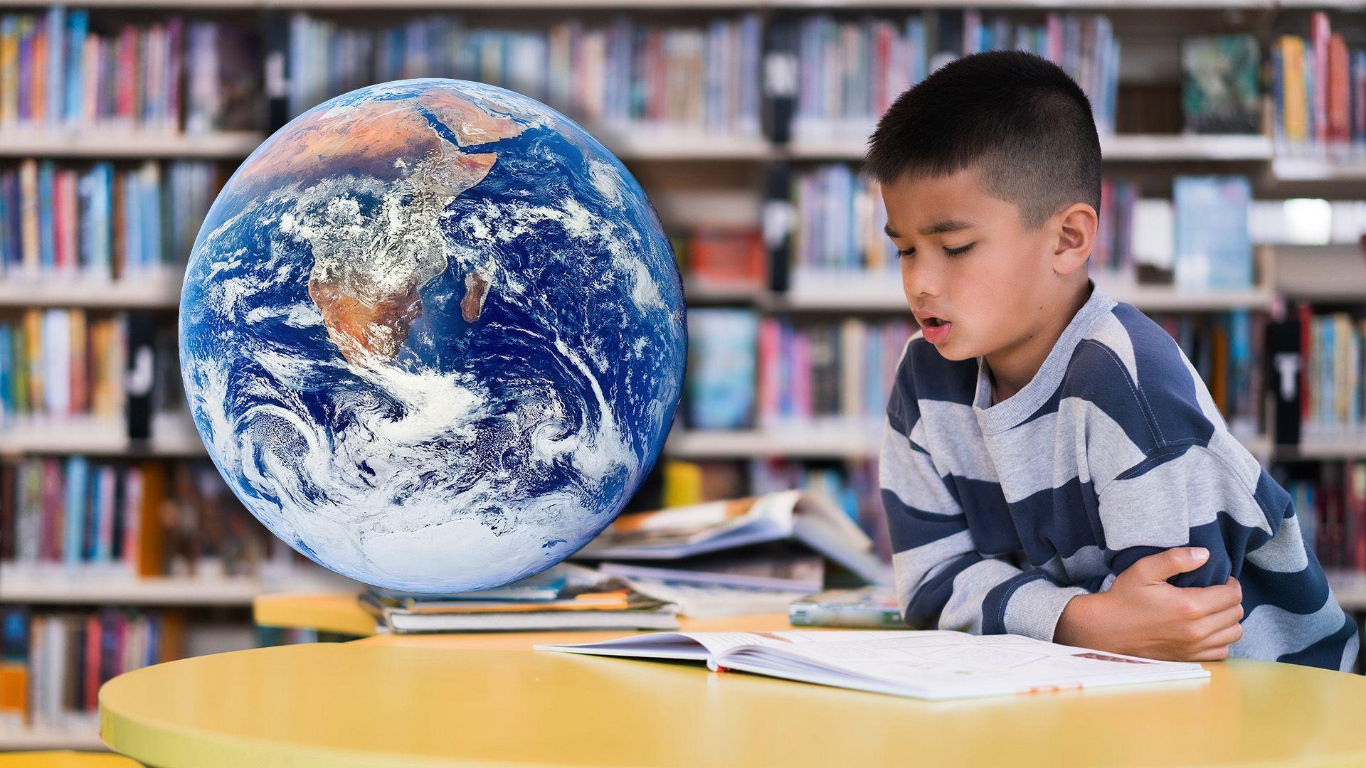 A child reads a book in the library. Superimposed next to him is an image of the Earth as seen from space.